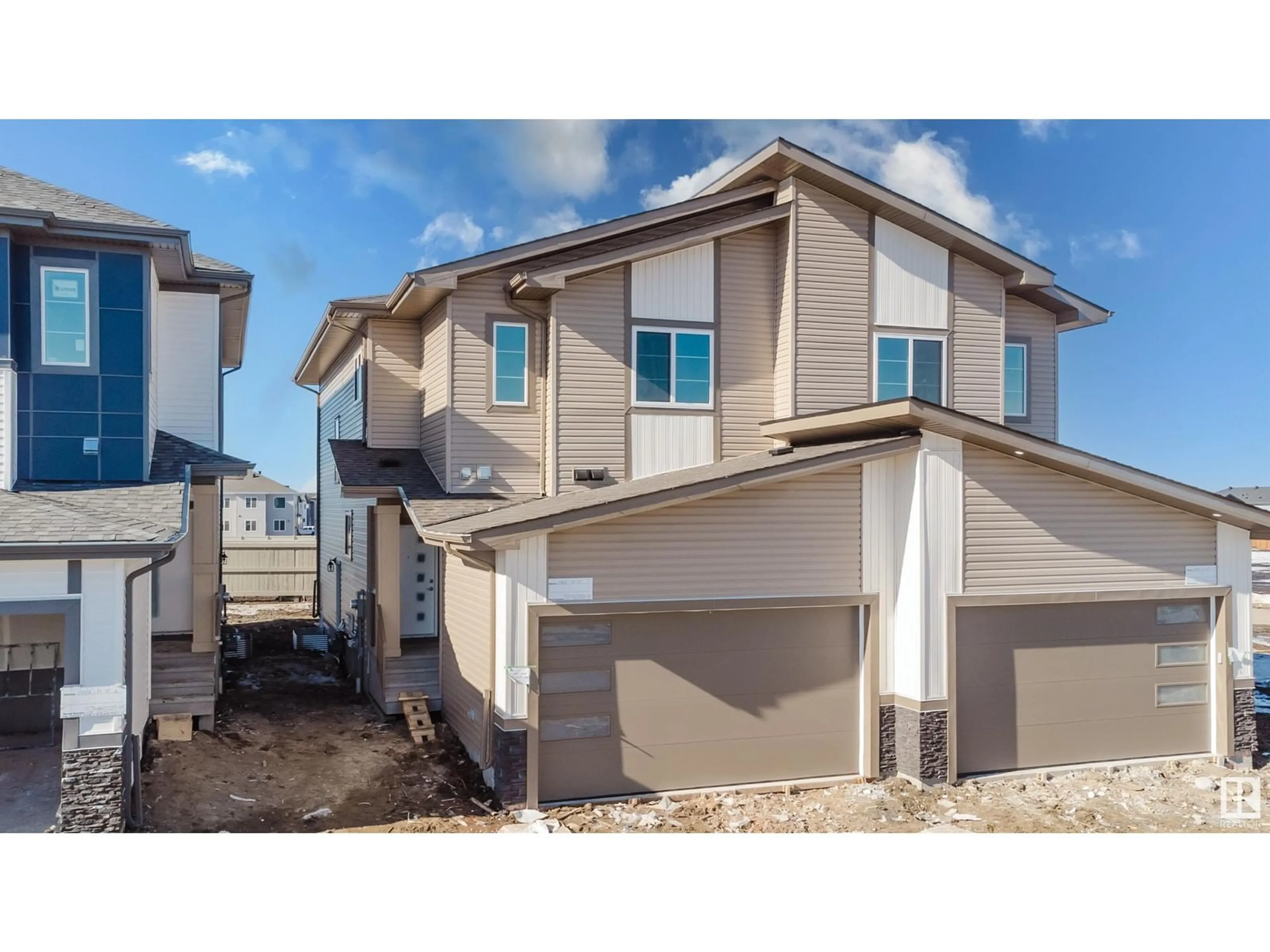 Home with vinyl exterior material, street for 1416 11 ST NW, Edmonton Alberta T6T0G9