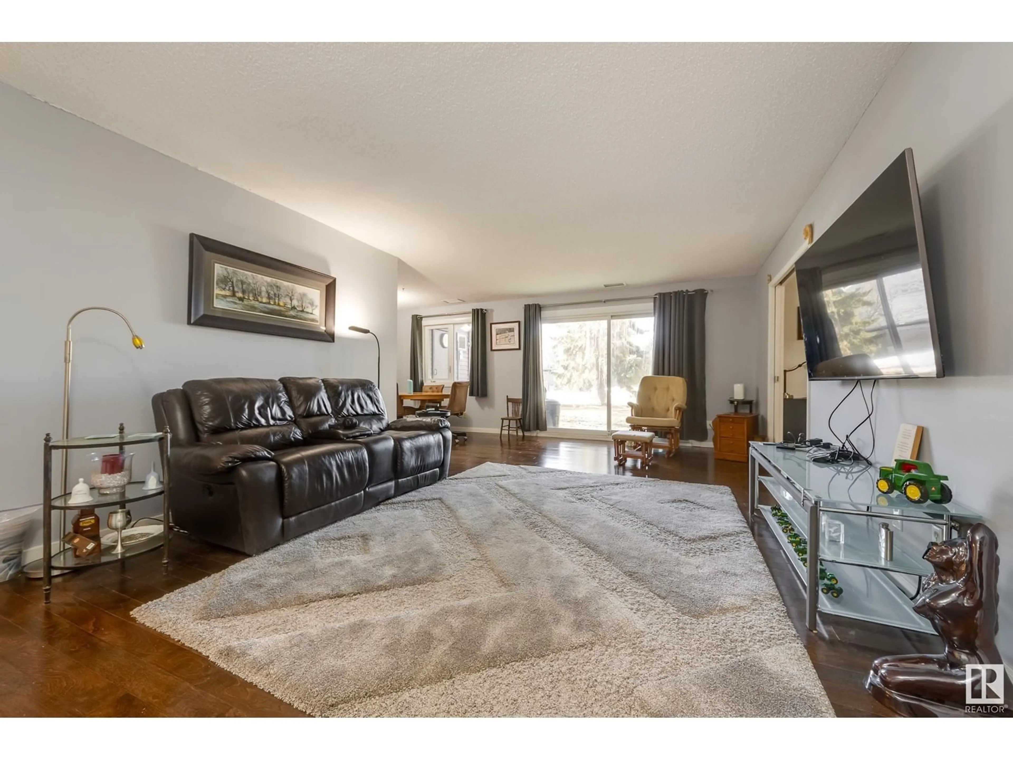 Living room with furniture, unknown for #108 14810 51 AV NW, Edmonton Alberta T6H5G5