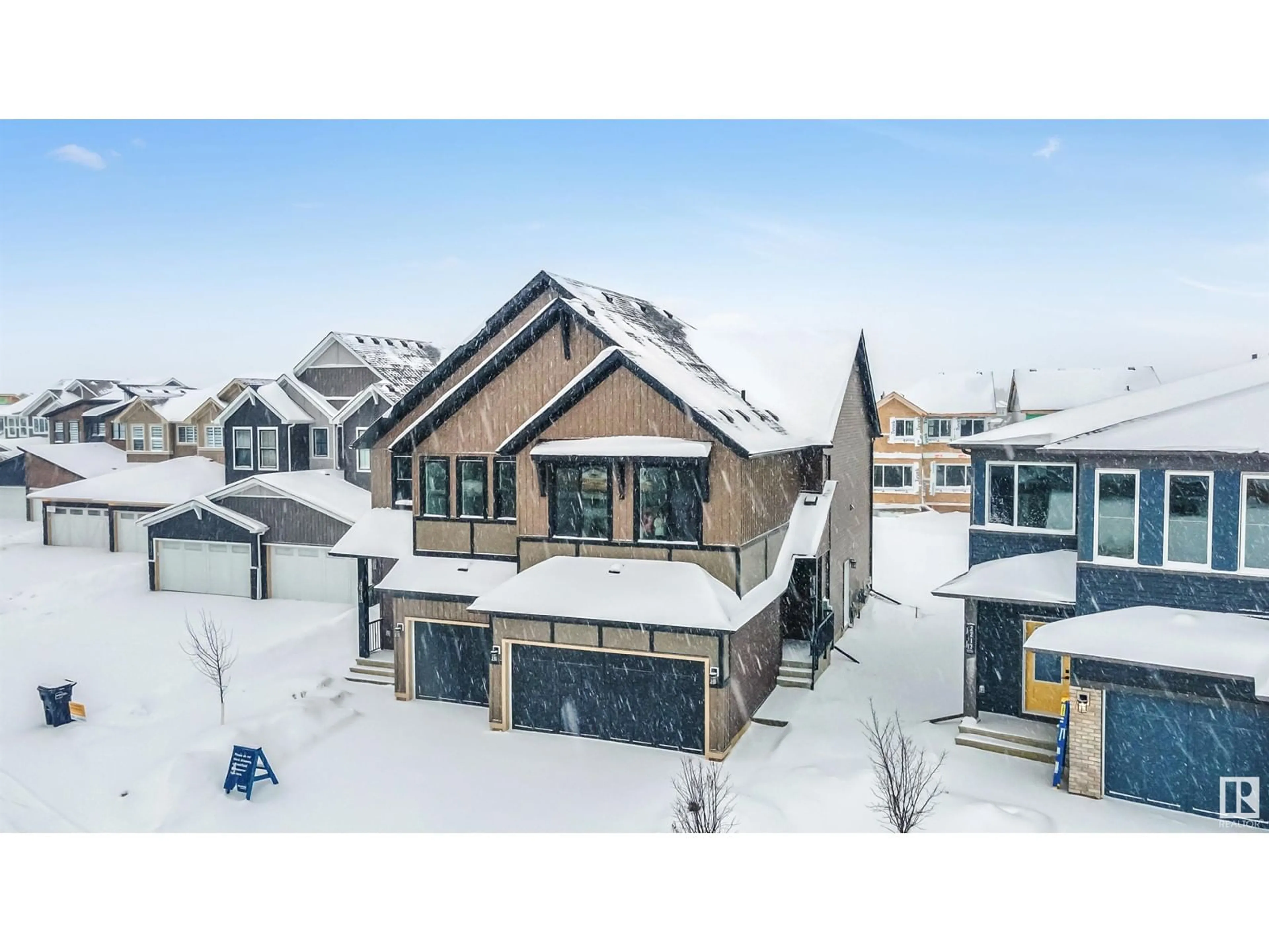 A pic from outside/outdoor area/front of a property/back of a property/a pic from drone, street for 2215 MUCKLEPLUM CR SW, Edmonton Alberta T6X3G7