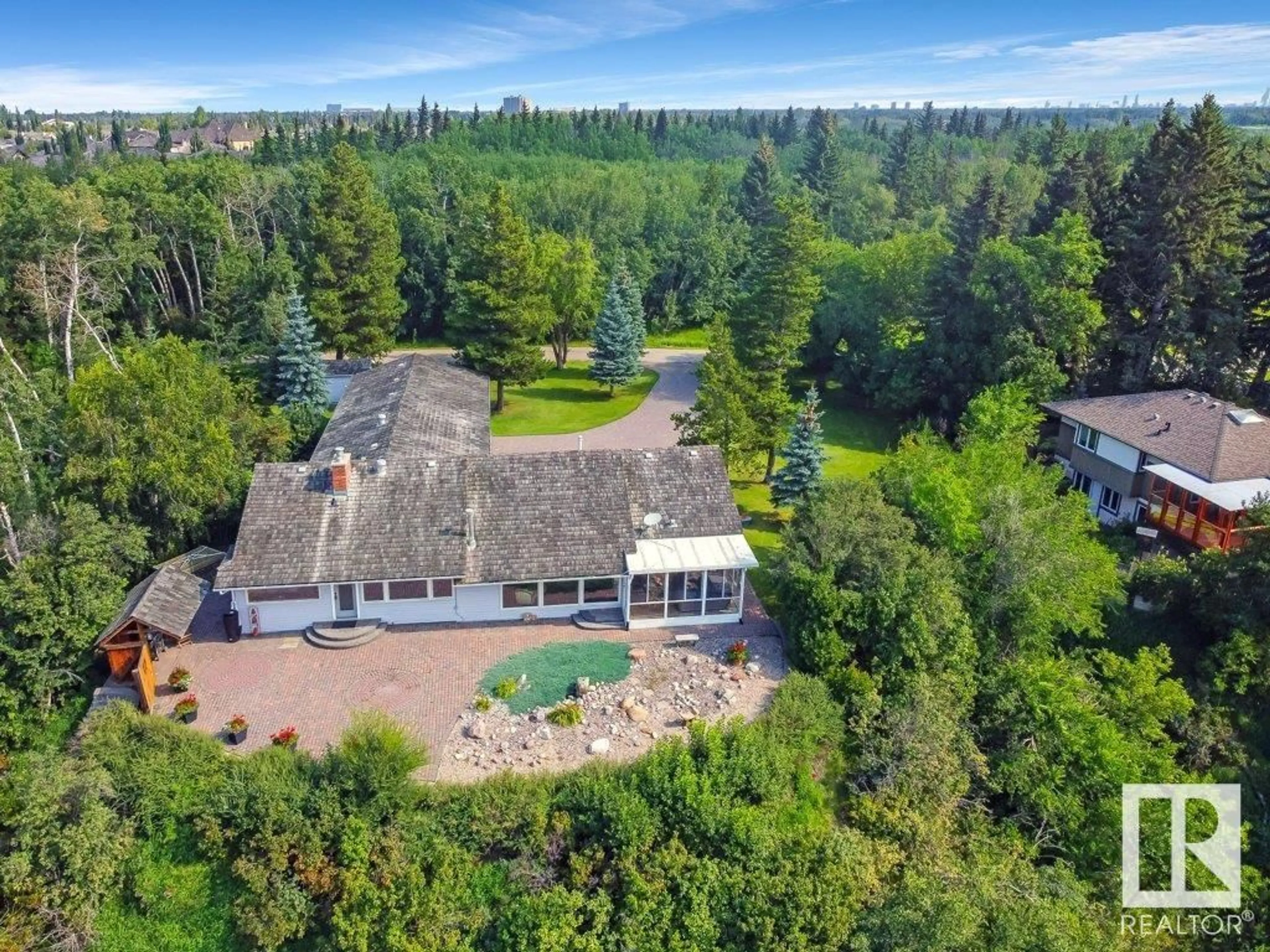 A pic from outside/outdoor area/front of a property/back of a property/a pic from drone, water/lake/river/ocean view for 1 DONSDALE CR NW, Edmonton Alberta T6M2N3