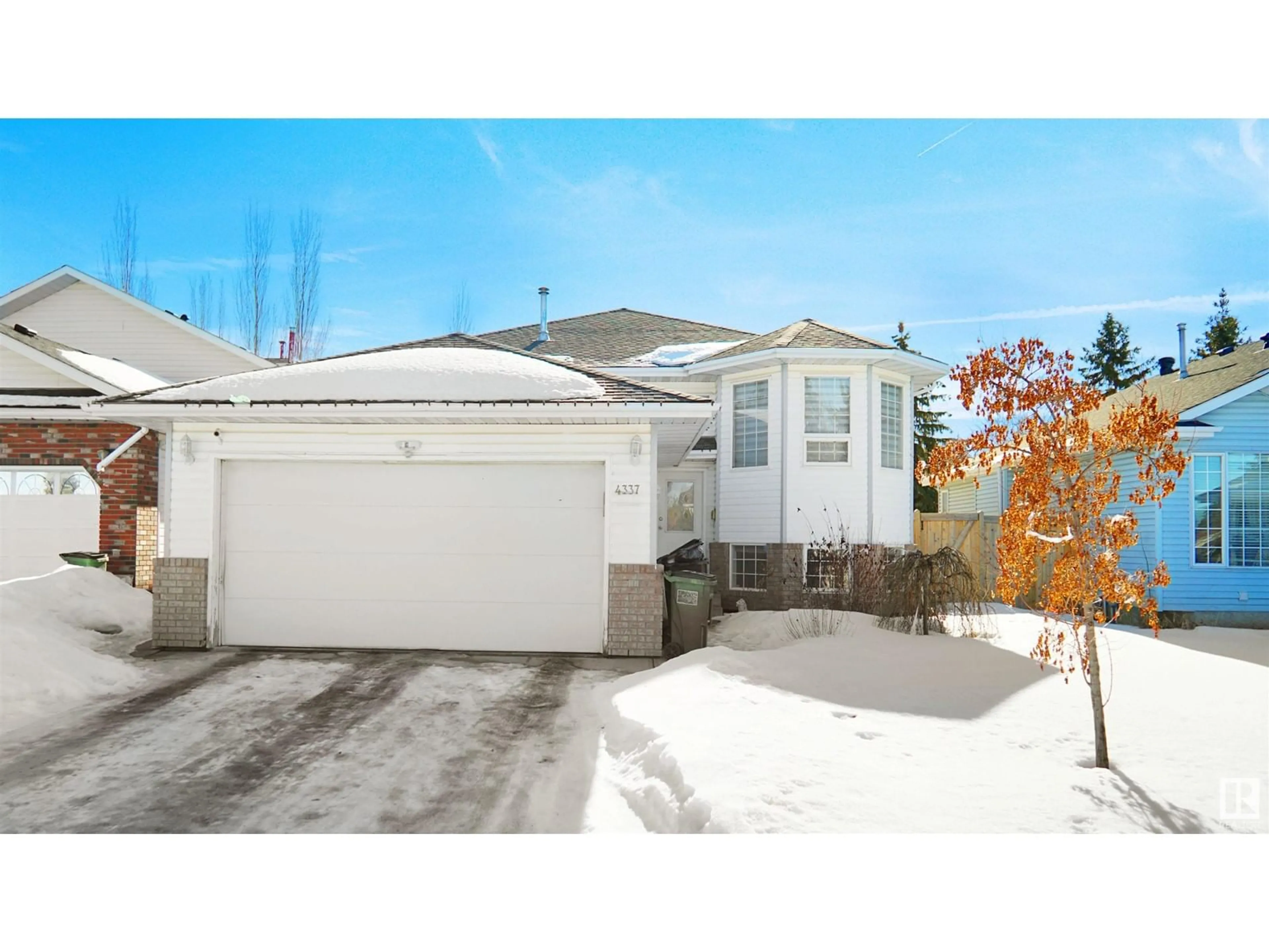 Home with vinyl exterior material, street for 4337 21 AV NW, Edmonton Alberta T6L6L8