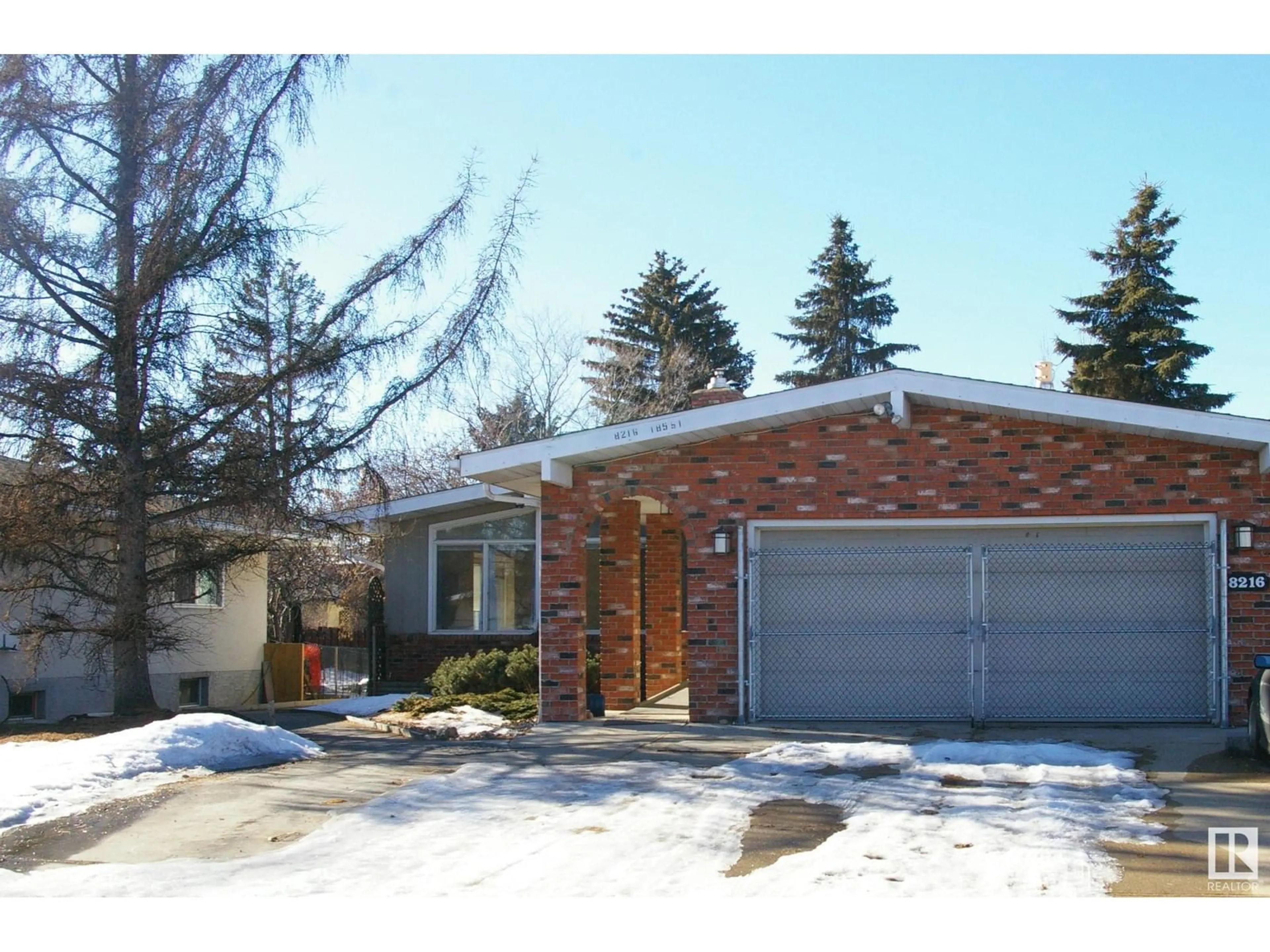 Home with brick exterior material, street for 8216 185 ST NW, Edmonton Alberta T5T1H1