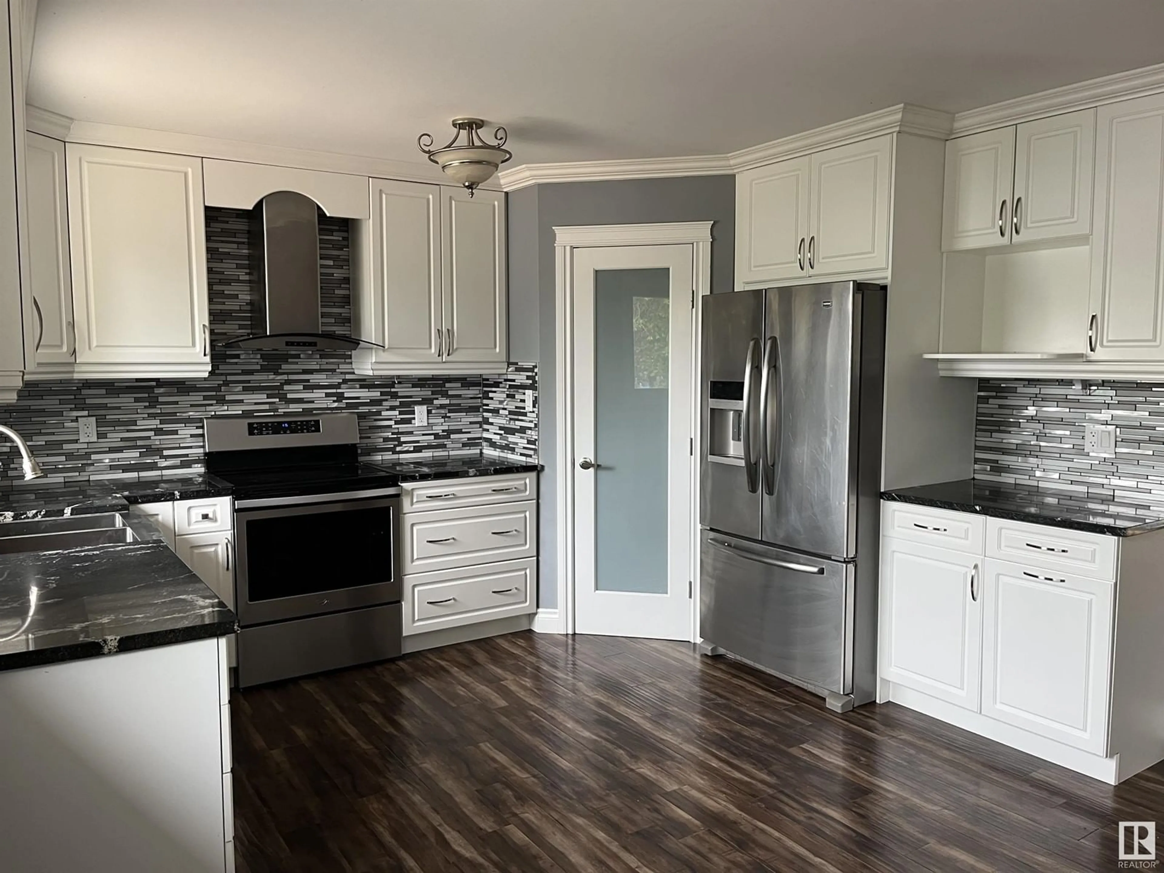 Open concept kitchen, wood/laminate floor for 405 - 61314 RR 463, Rural Bonnyville M.D. Alberta T9N2G9