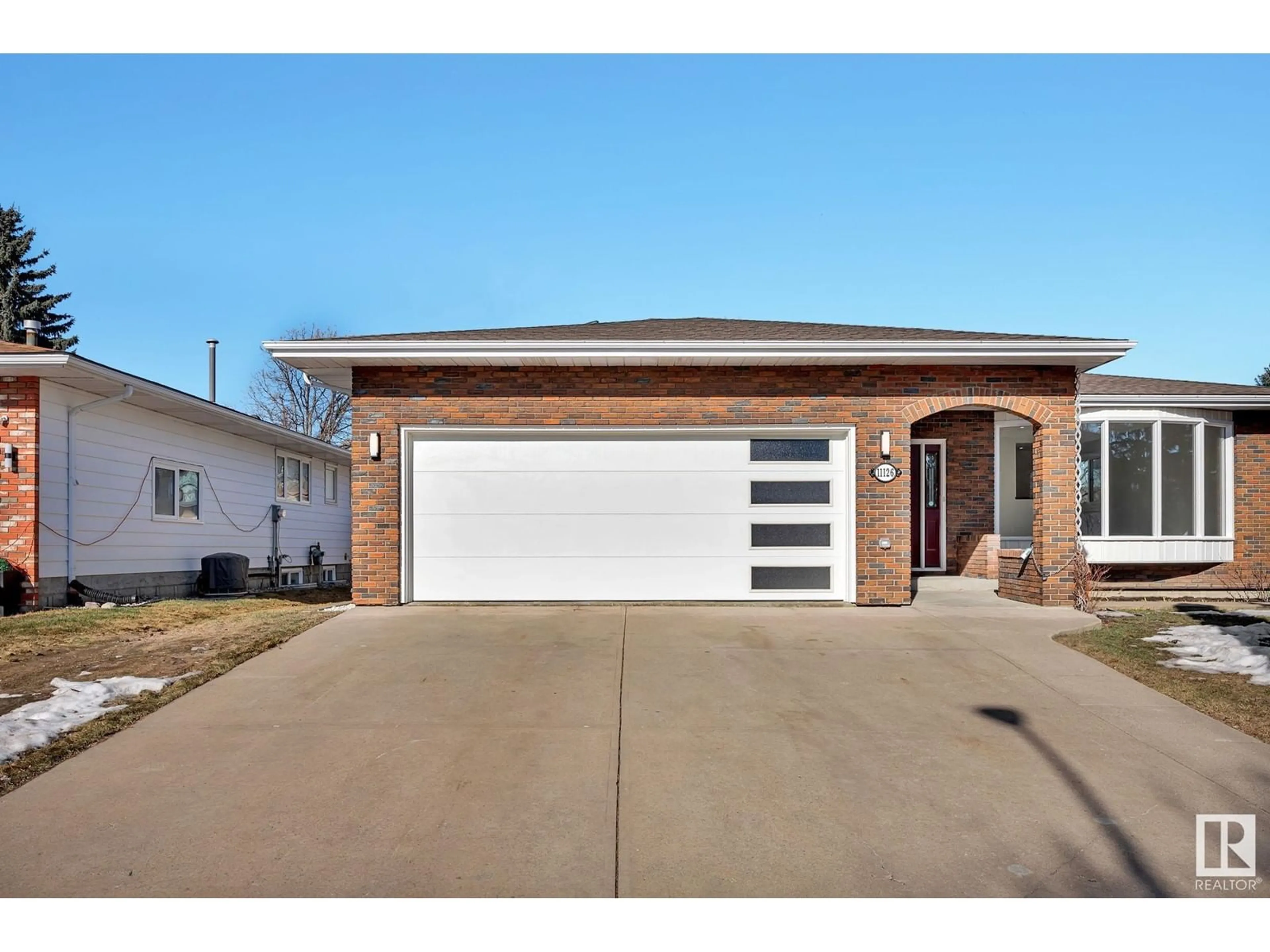 Home with brick exterior material, street for 11126 29A AV NW, Edmonton Alberta T6J3Z3