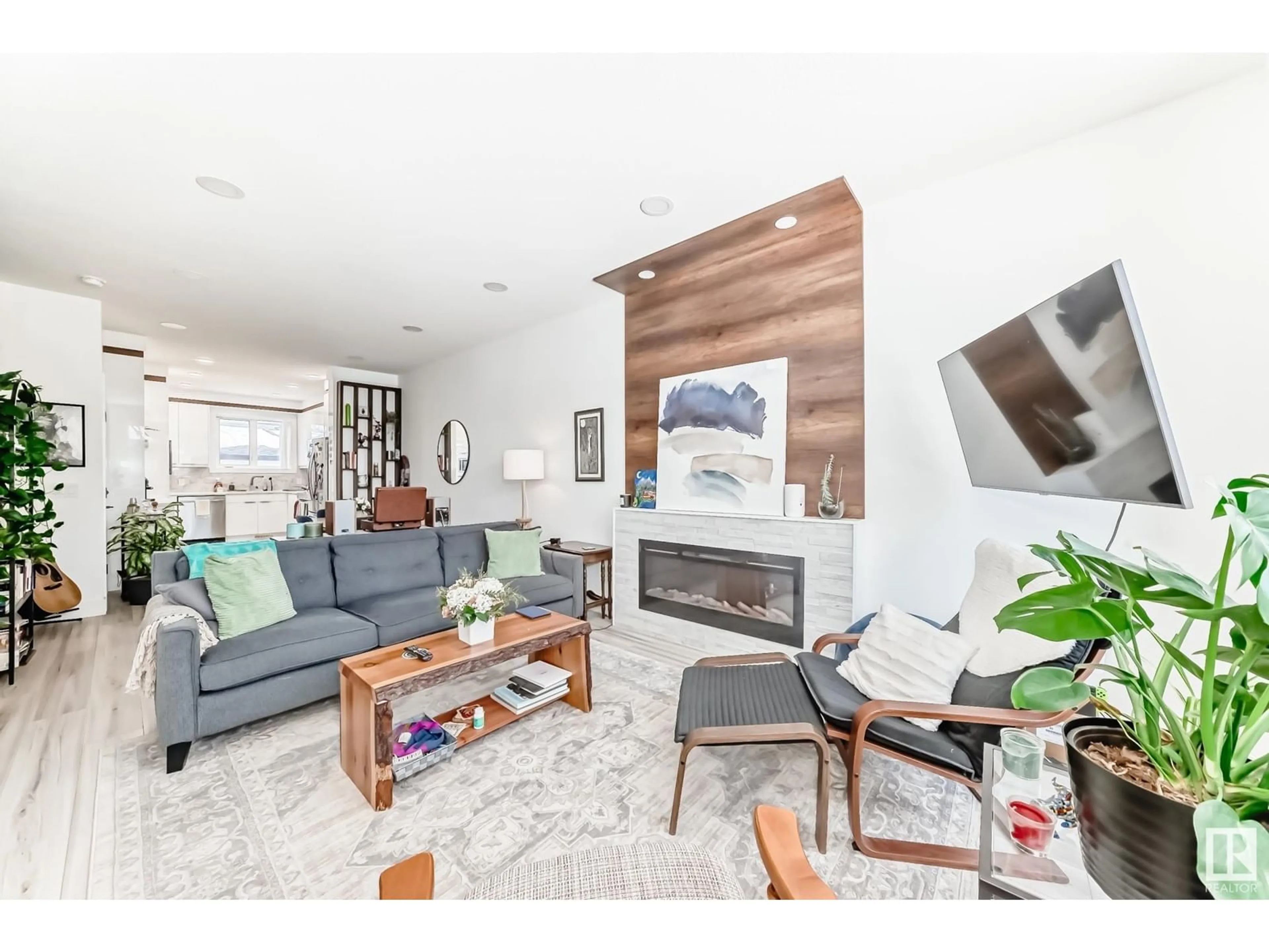 Living room with furniture, wood/laminate floor for 7222 112 ST, Edmonton Alberta T6G1J3