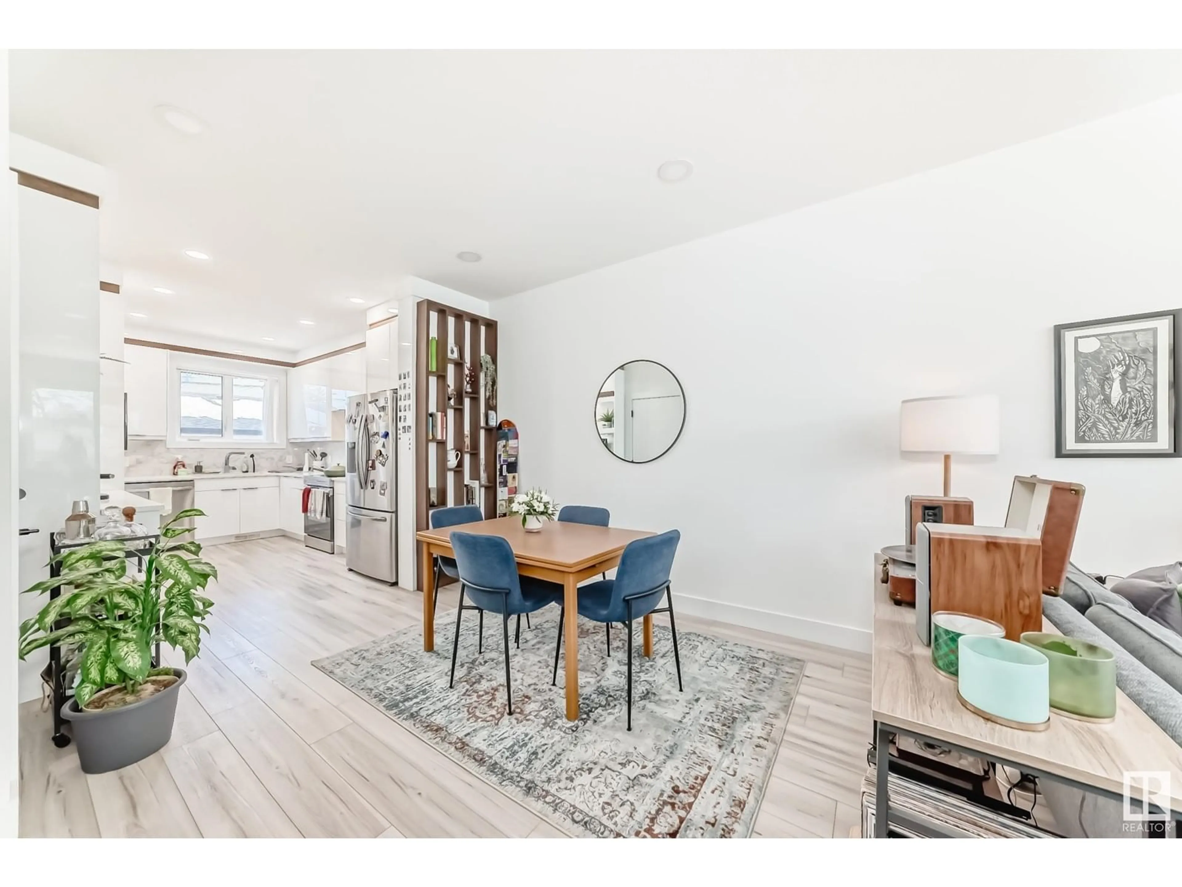 Open concept kitchen, wood/laminate floor for 7222 112 ST, Edmonton Alberta T6G1J3