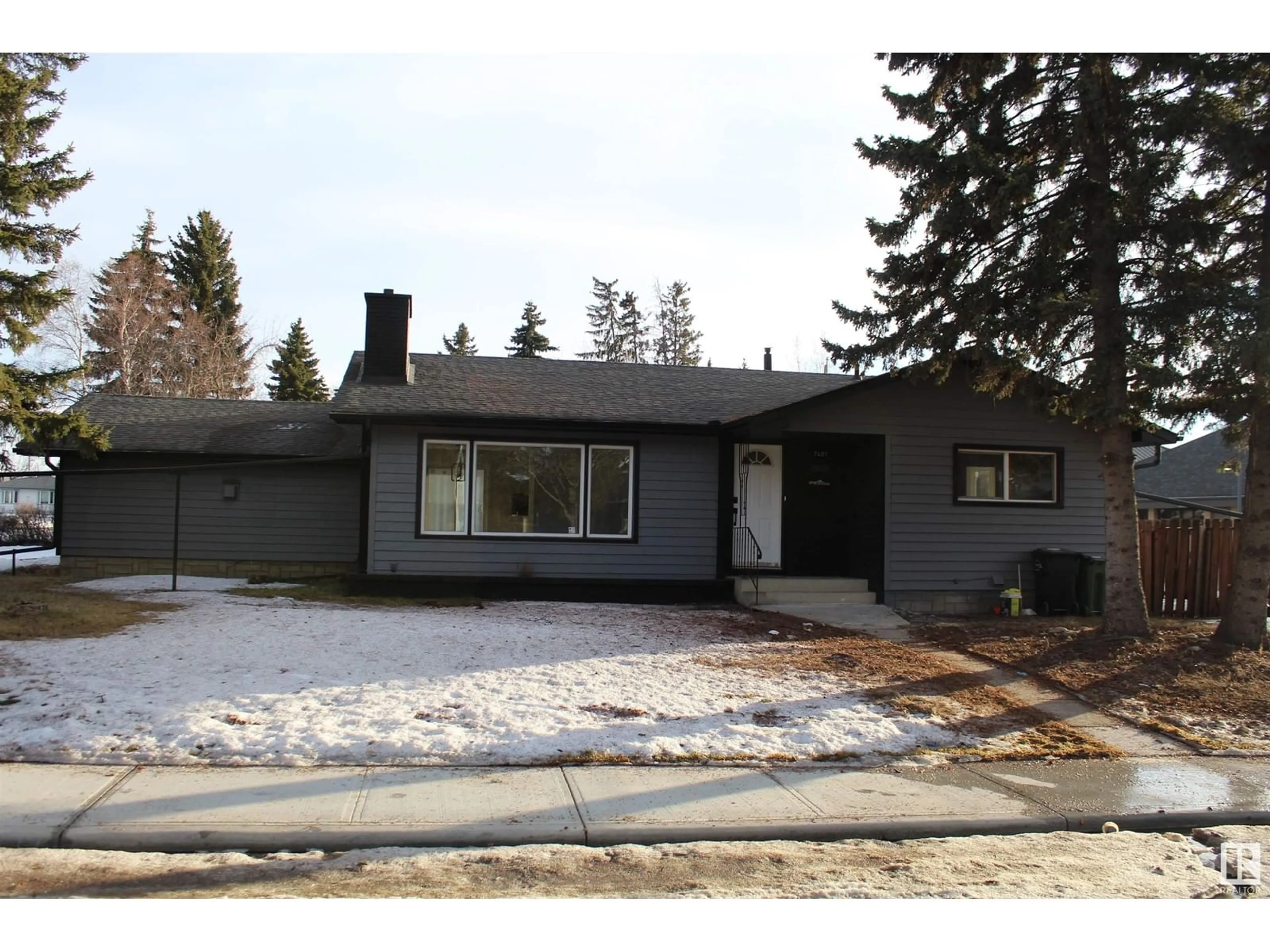 Home with vinyl exterior material, street for 7407 92 AV NW, Edmonton Alberta T6B0S8