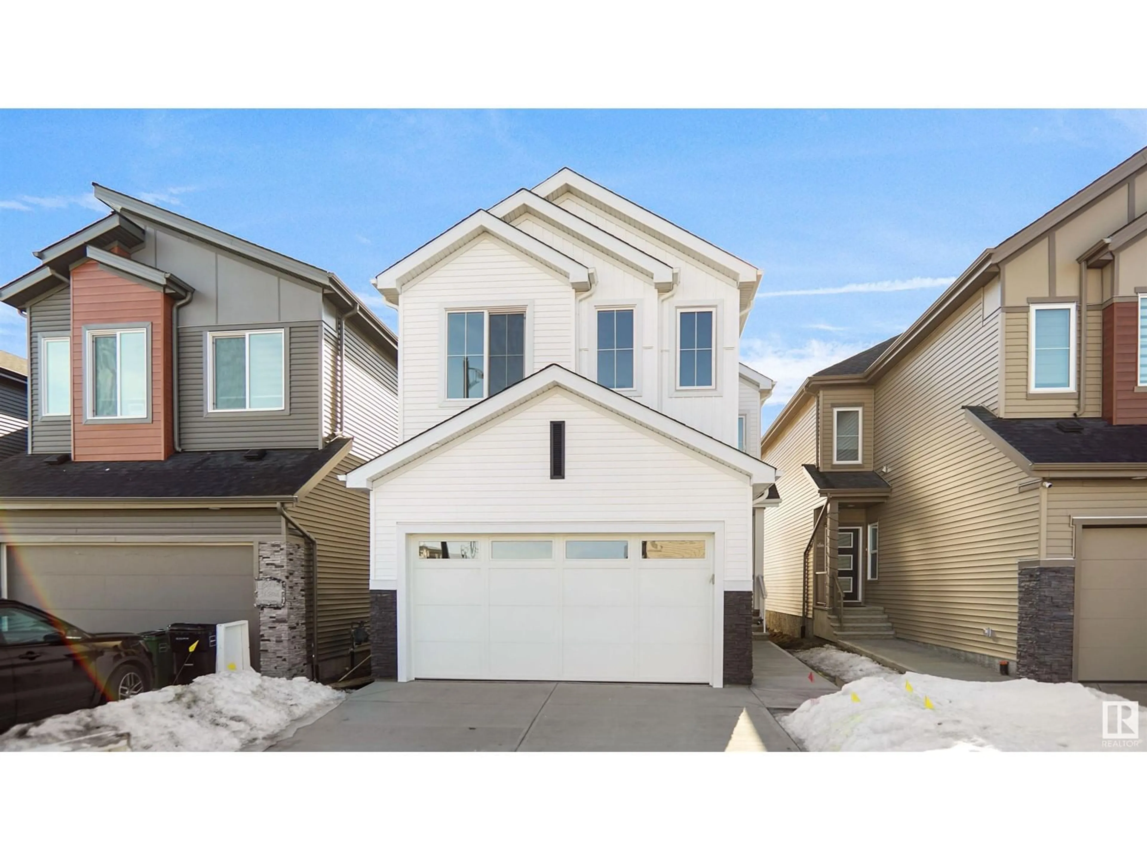 Home with vinyl exterior material, street for 4807 168 AV NW, Edmonton Alberta T5Y0W3