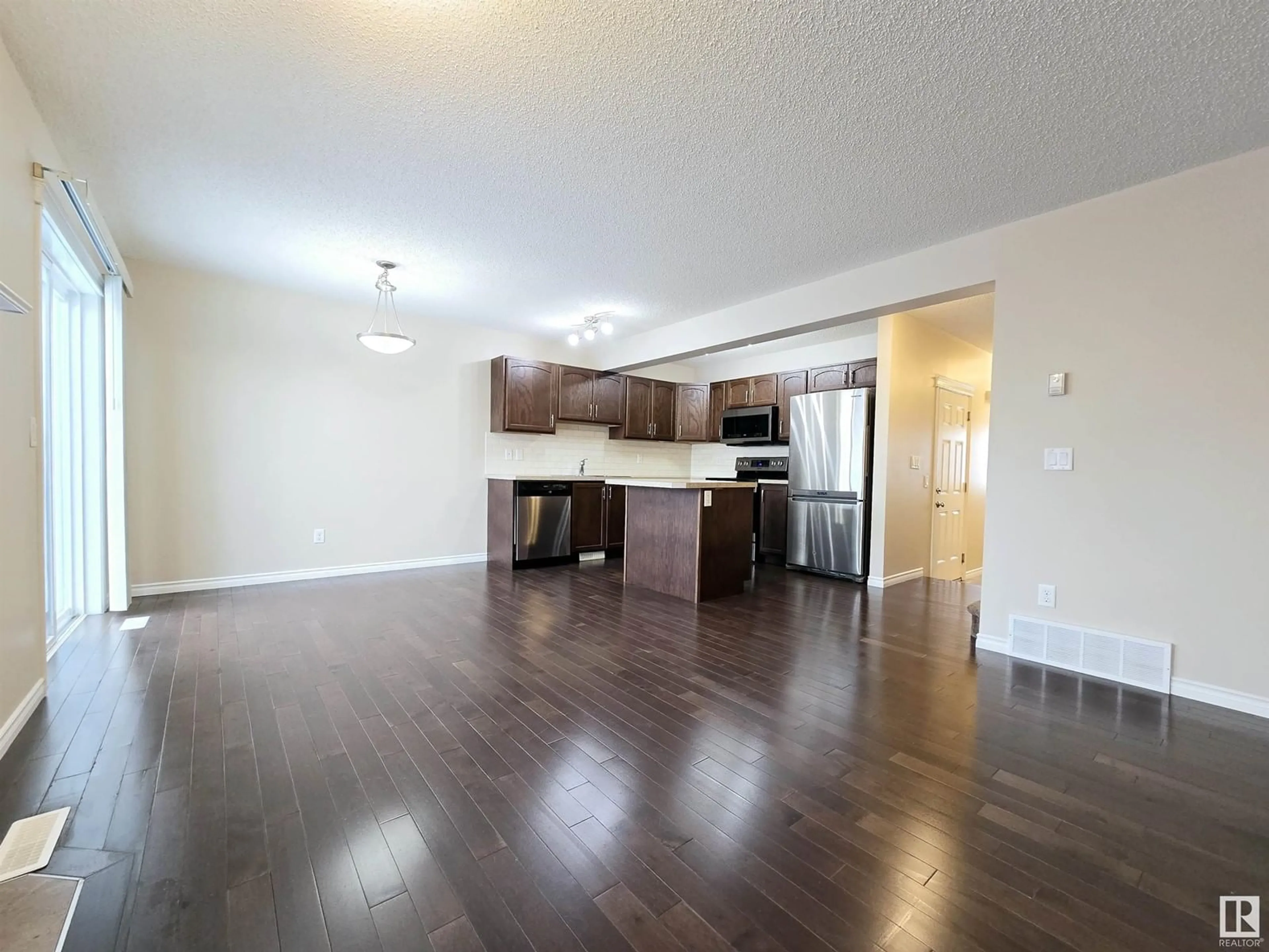 Open concept kitchen, wood/laminate floor for 21308 45A AV NW, Edmonton Alberta T6M0G8