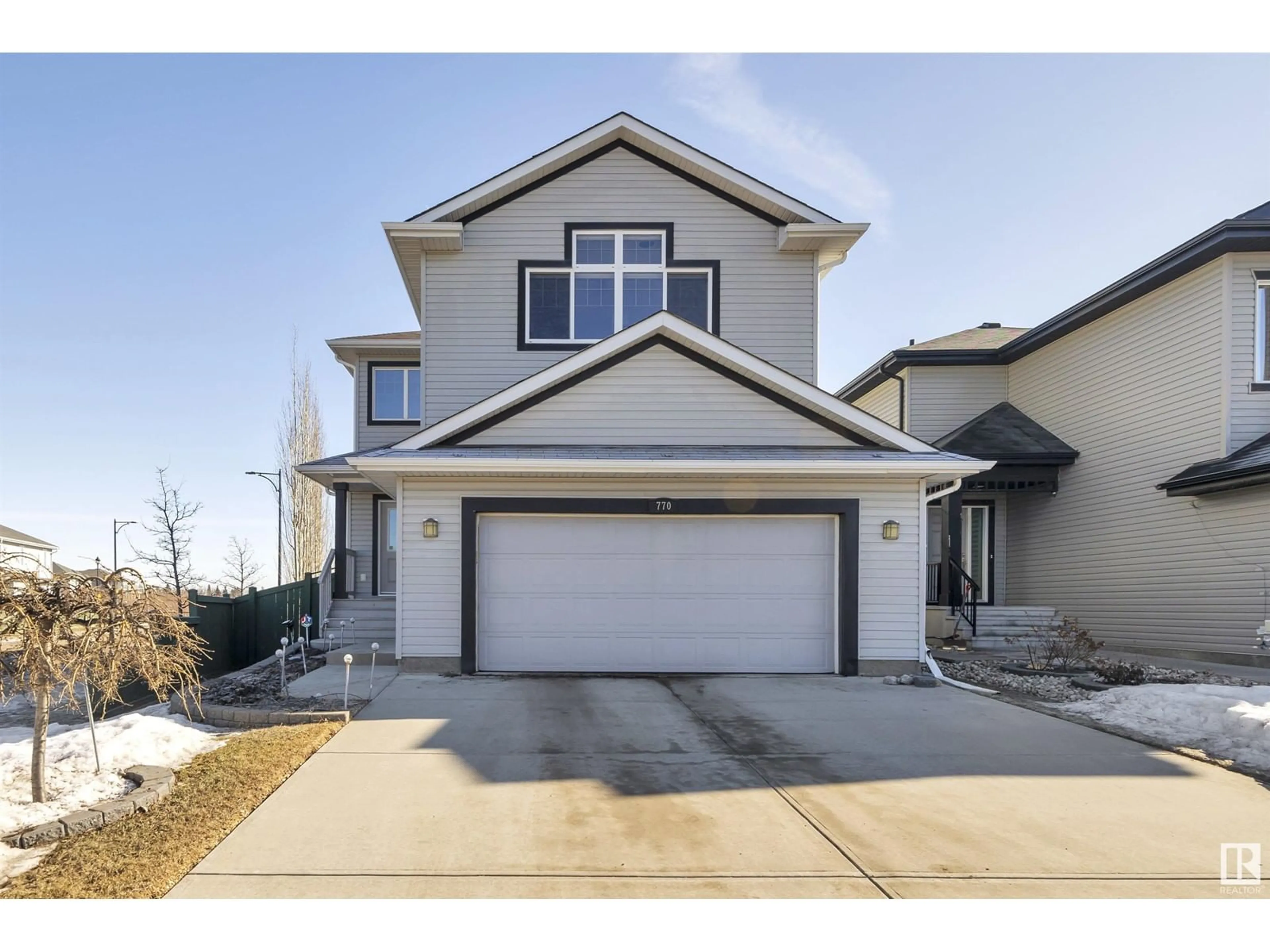 Home with vinyl exterior material, street for 770 LEWIS GREENS DR NW, Edmonton Alberta T5T4N1