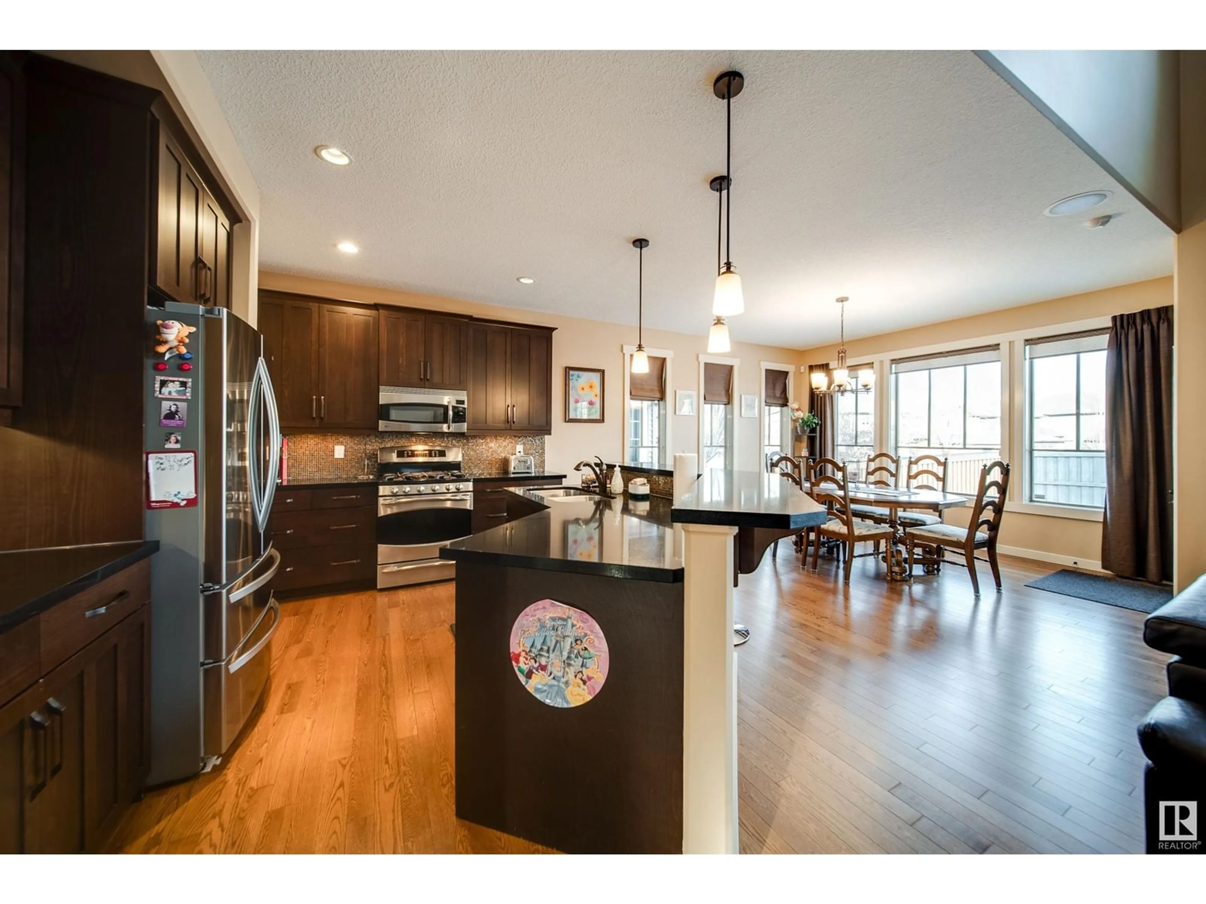 Open concept kitchen, wood/laminate floor for 2805 ANDERSON PL SW, Edmonton Alberta T6W0V7