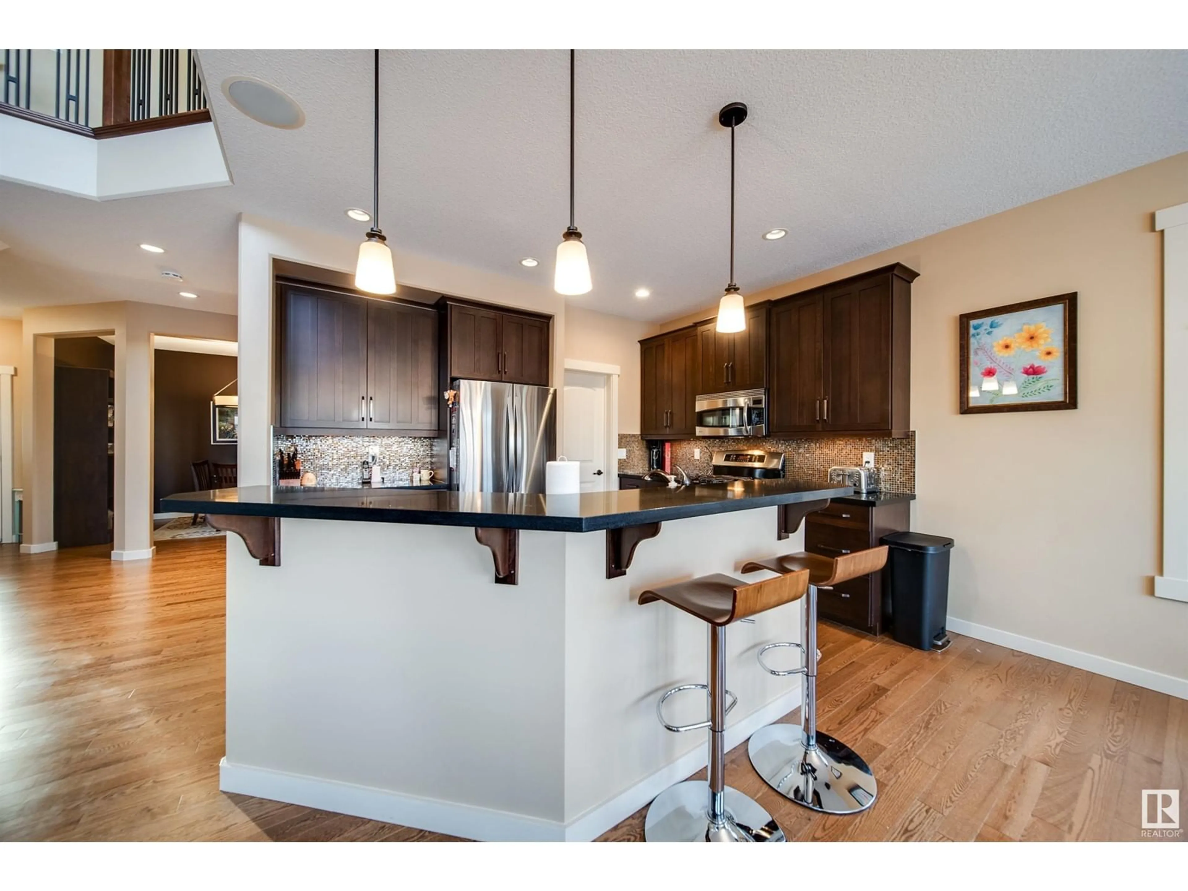 Open concept kitchen, wood/laminate floor for 2805 ANDERSON PL SW, Edmonton Alberta T6W0V7