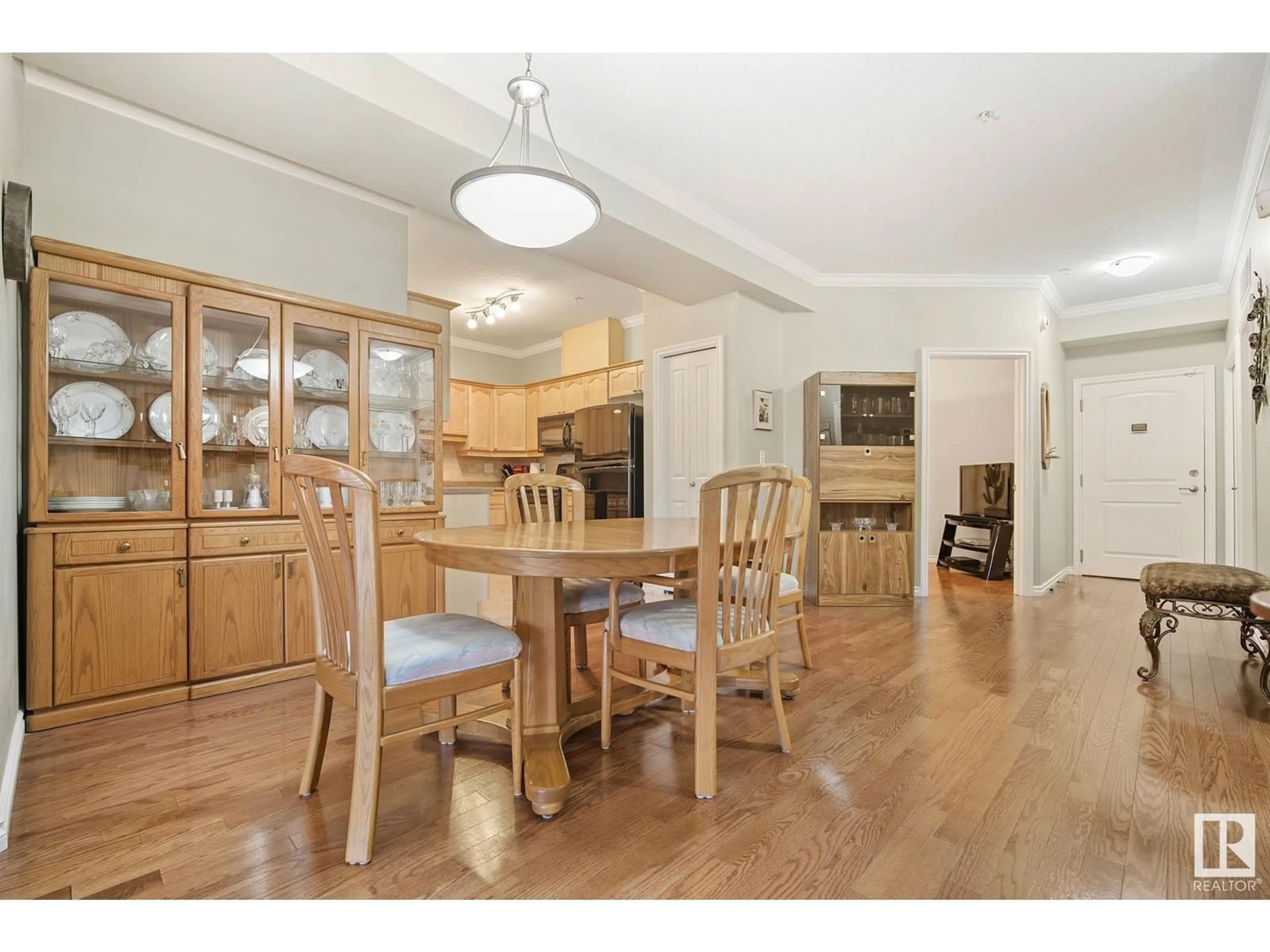 Dining room, wood/laminate floor for #127 8528 82 AV NW, Edmonton Alberta T6C0Y8