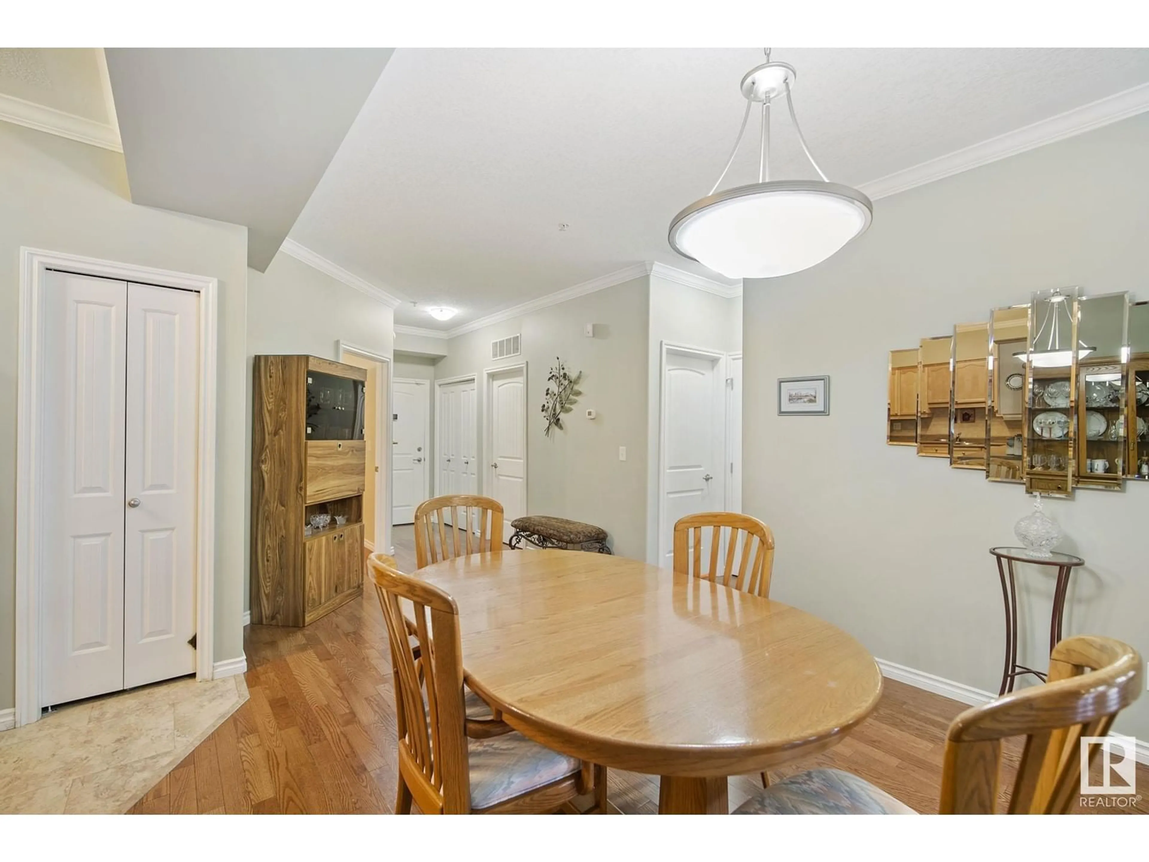 Dining room, wood/laminate floor for #127 8528 82 AV NW, Edmonton Alberta T6C0Y8