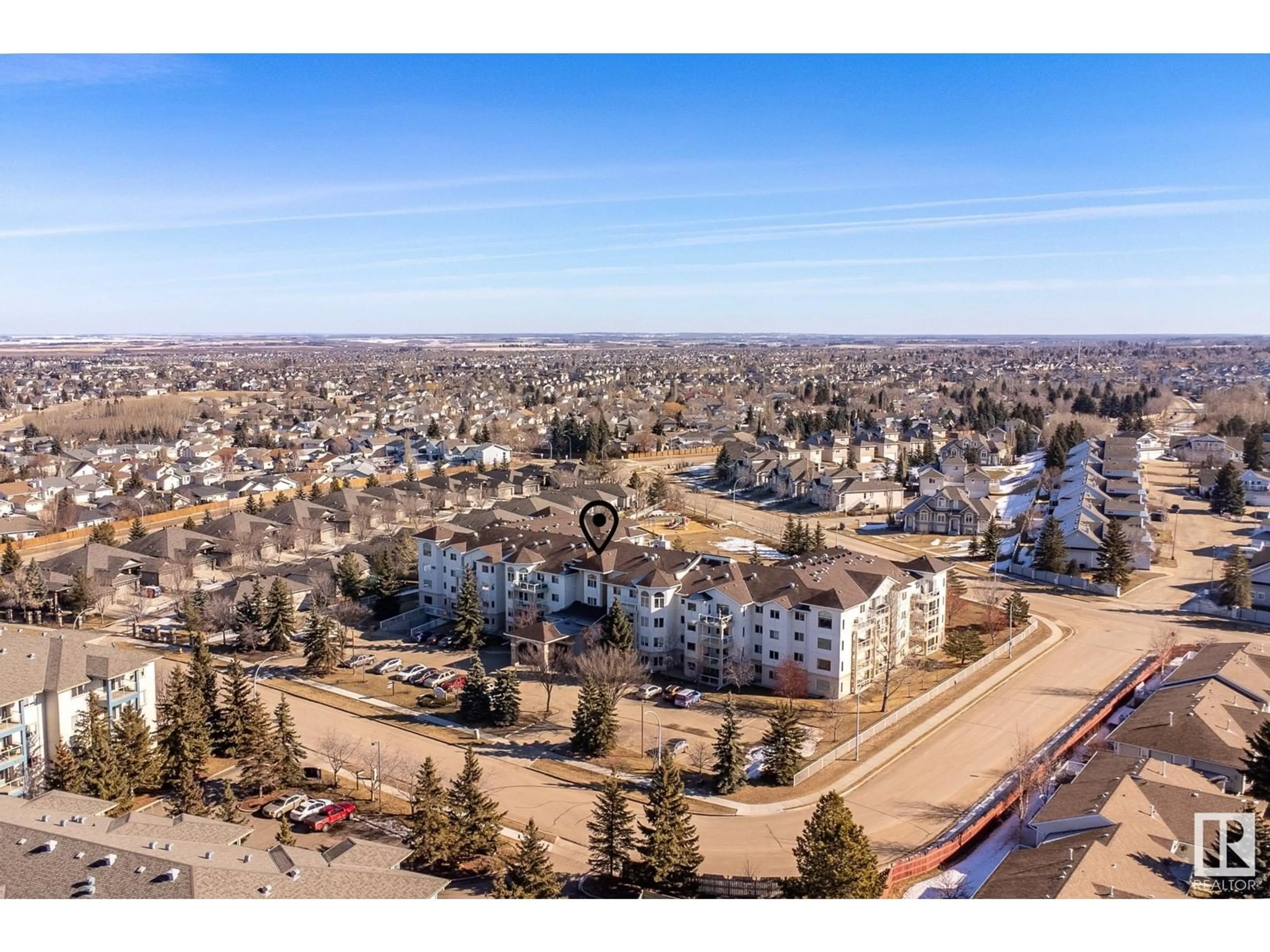 A pic from outside/outdoor area/front of a property/back of a property/a pic from drone, mountain view for #305 69 CRYSTAL LN, Sherwood Park Alberta T8H2E9