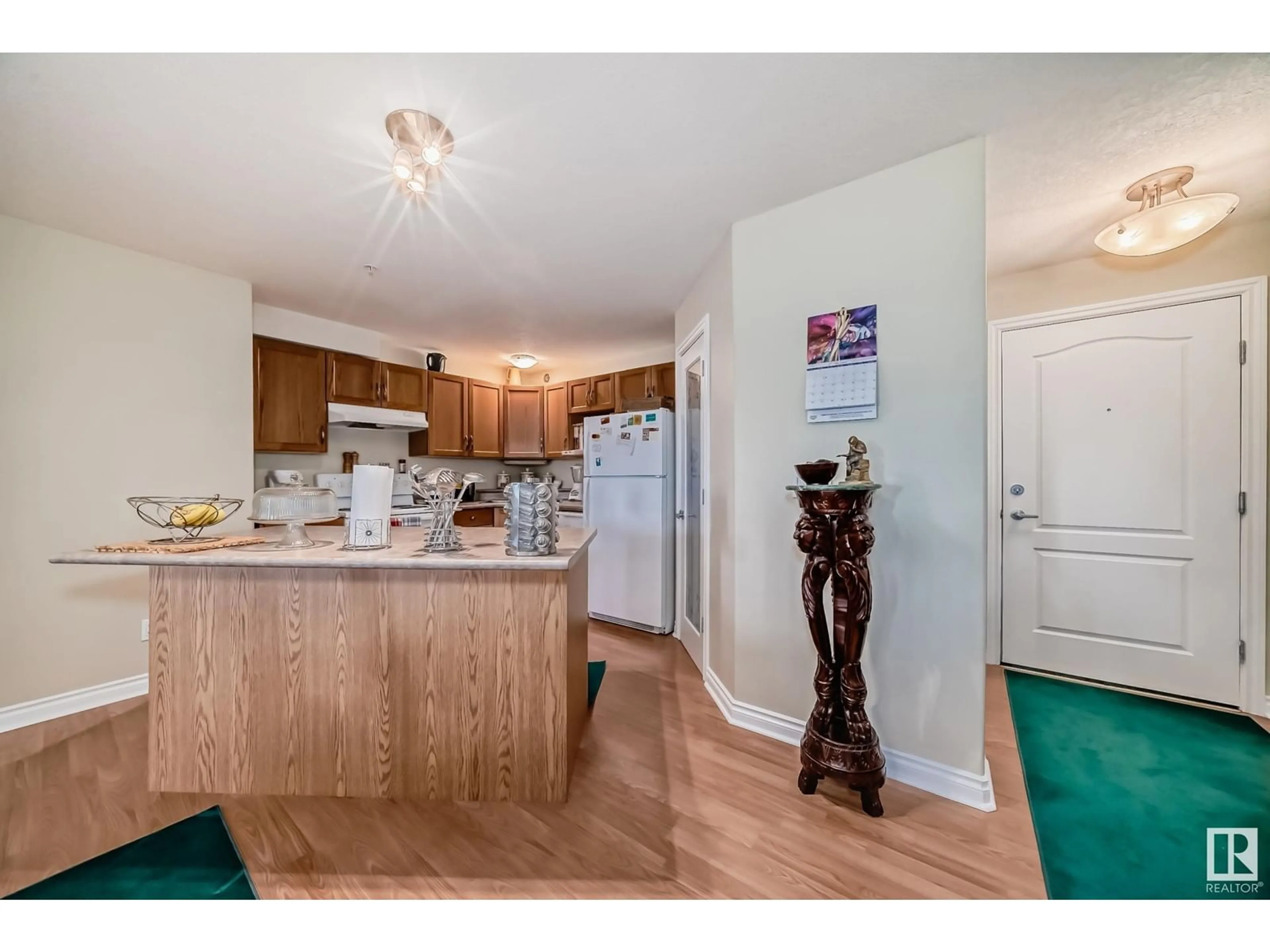 Open concept kitchen, wood/laminate floor for 317 9995 93 AV, Fort Saskatchewan Alberta T8L1N5
