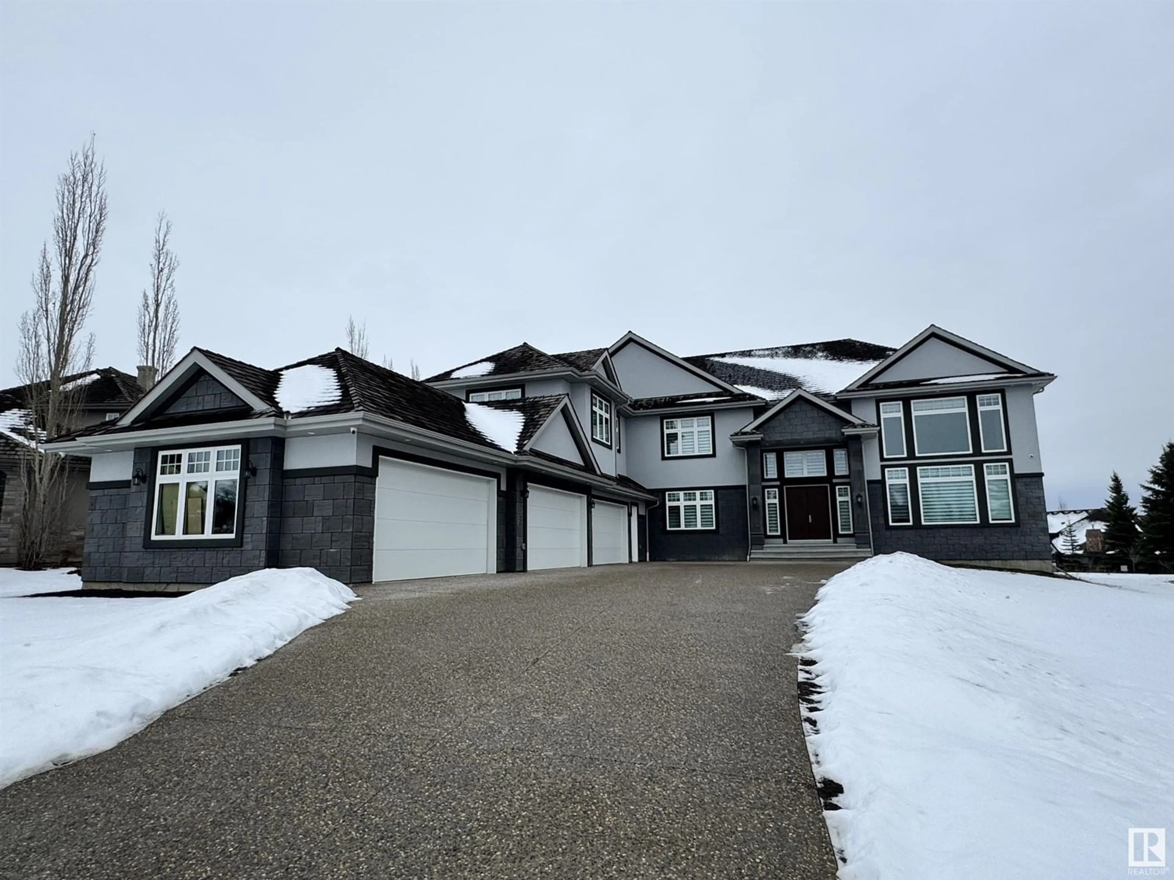 Home with vinyl exterior material, street for 60 Riverstone CL, Rural Sturgeon County Alberta T8T0B9