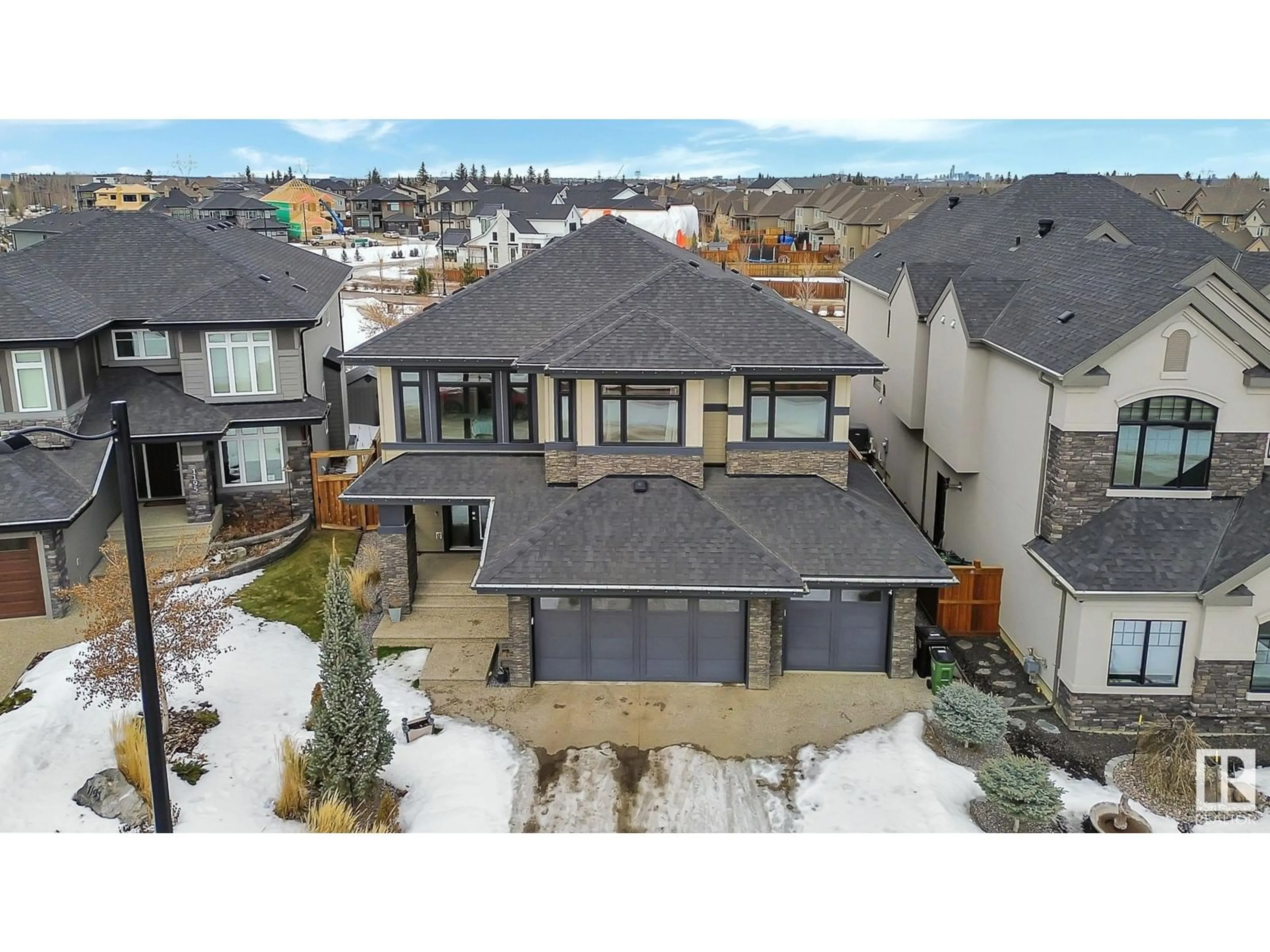 A pic from outside/outdoor area/front of a property/back of a property/a pic from drone, mountain view for 1197 HAINSTOCK GR SW, Edmonton Alberta T6W3B6