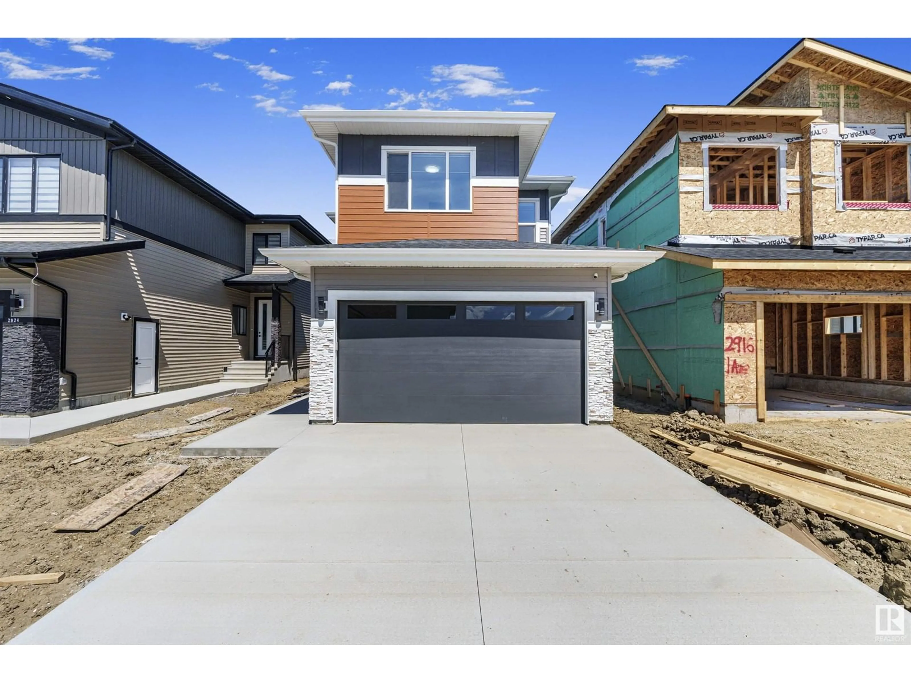 Home with vinyl exterior material, street for 2920 1 AV SW, Edmonton Alberta T6X3E2