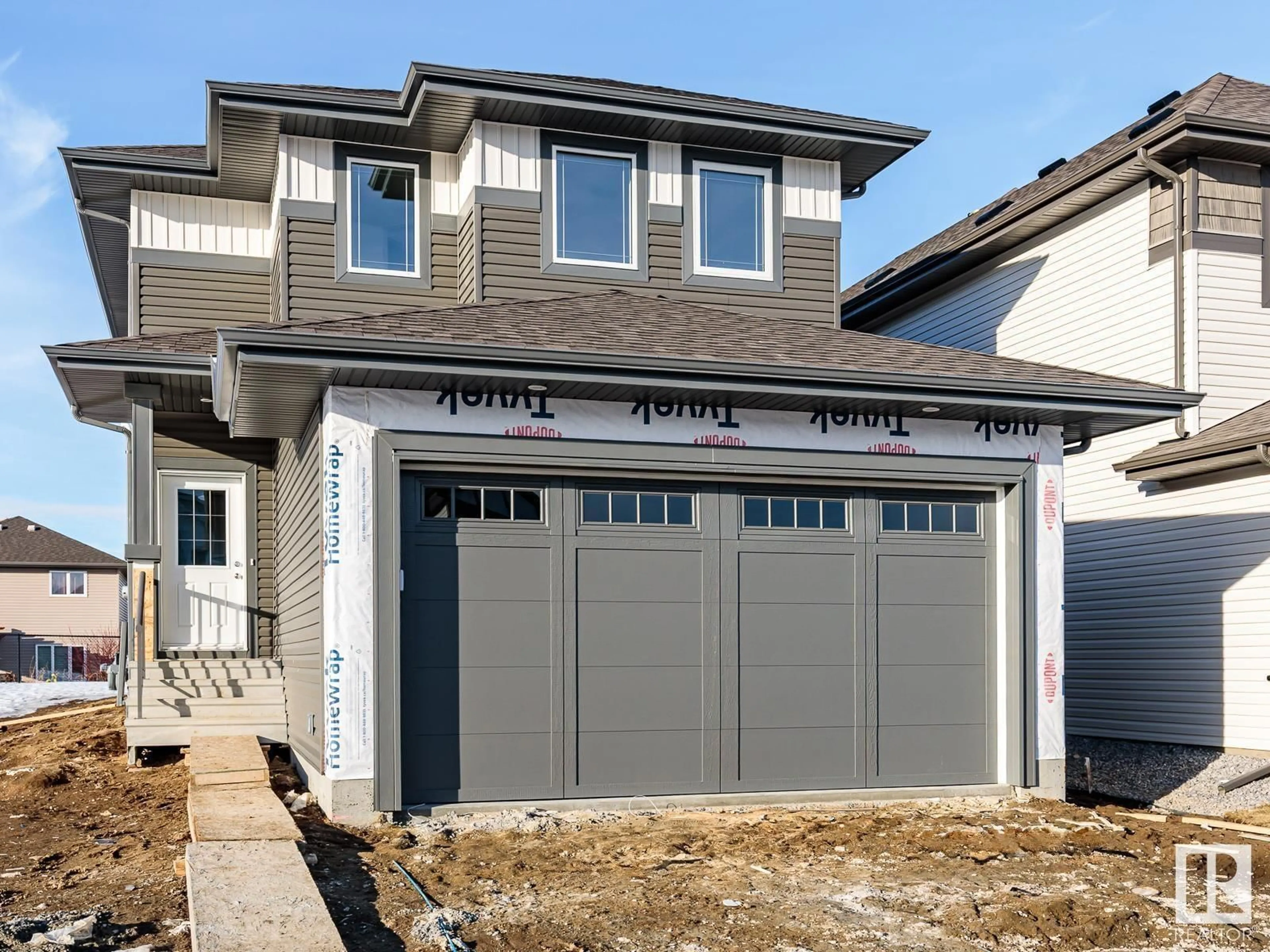 Home with vinyl exterior material, street for 74 SILVERSTONE DR, Stony Plain Alberta T7Z0E8