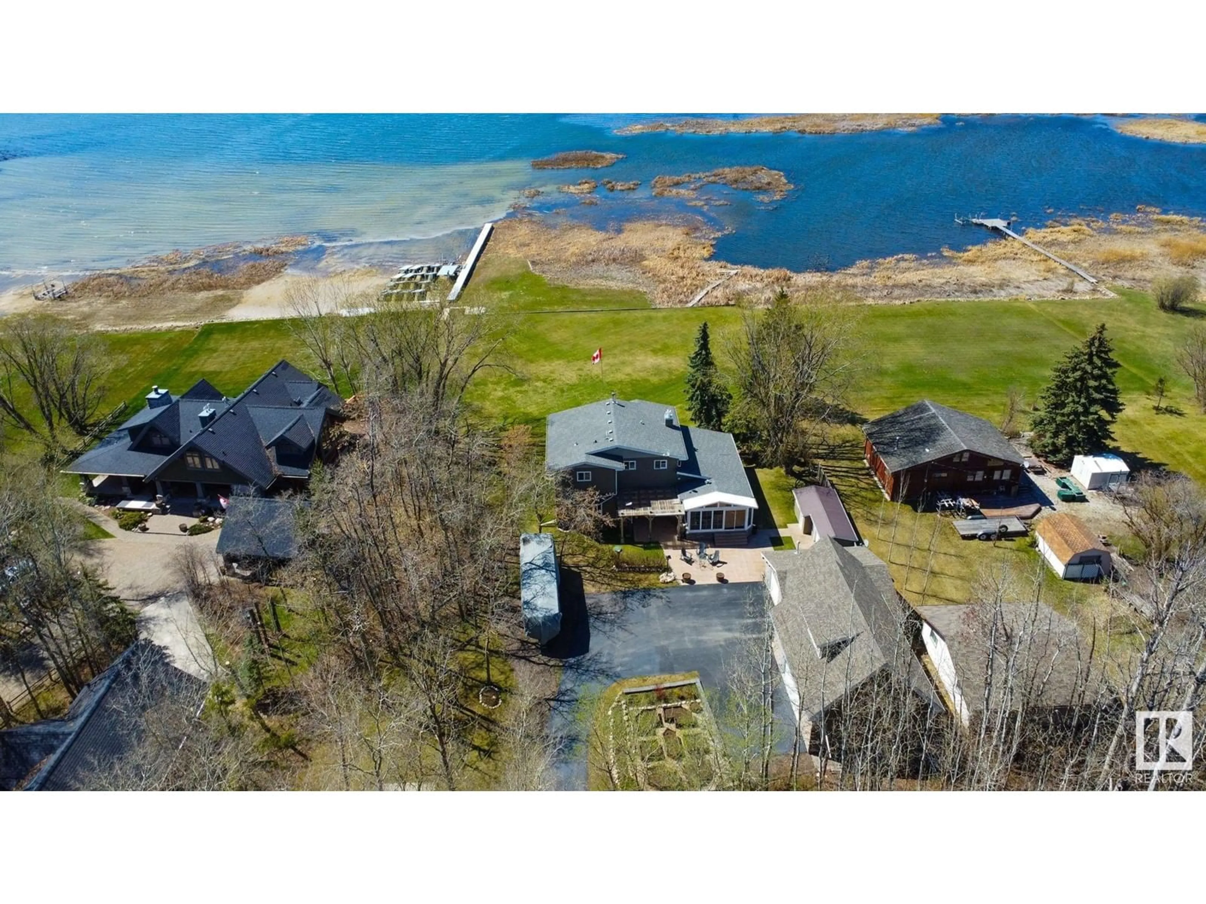 A pic from outside/outdoor area/front of a property/back of a property/a pic from drone, water/lake/river/ocean view for #4 54524 STE. ANNE TR, Rural Lac Ste. Anne County Alberta T0E0A0