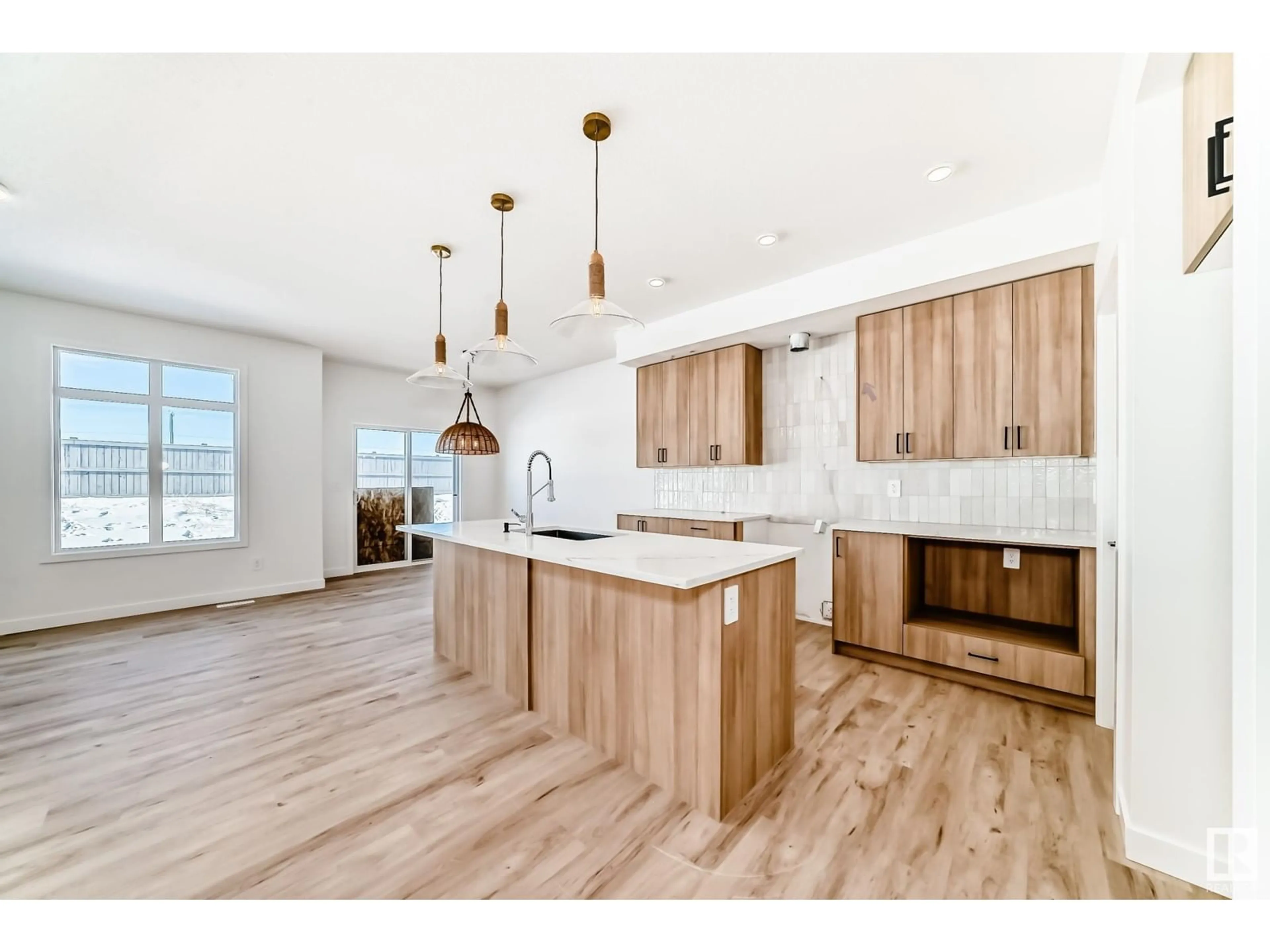 Open concept kitchen, wood/laminate floor for 8207 Kiriak LO SW, Edmonton Alberta T6W5S2