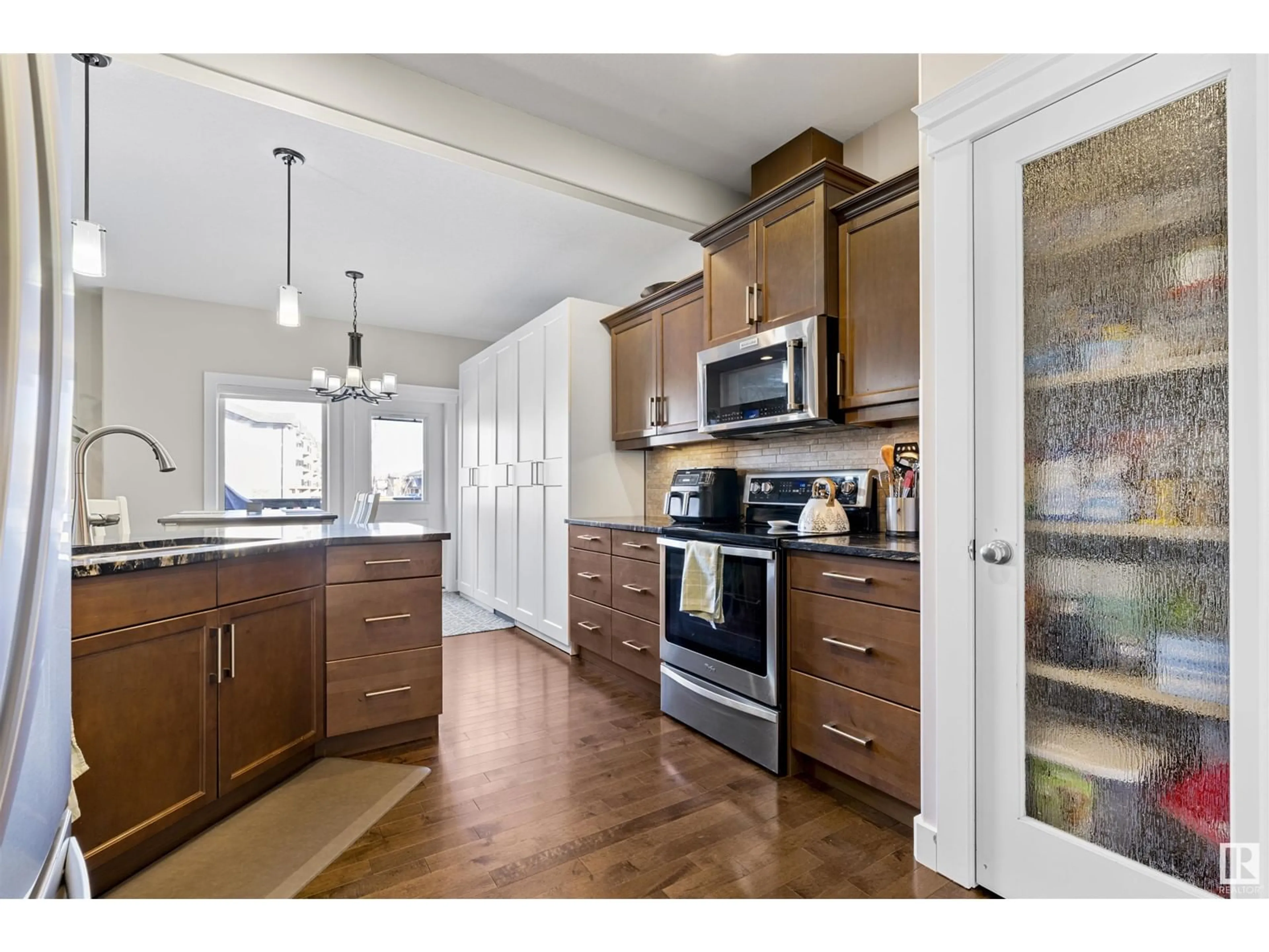 Open concept kitchen, unknown for #121 8602 SOUTHFORT BV, Fort Saskatchewan Alberta T8L0J8