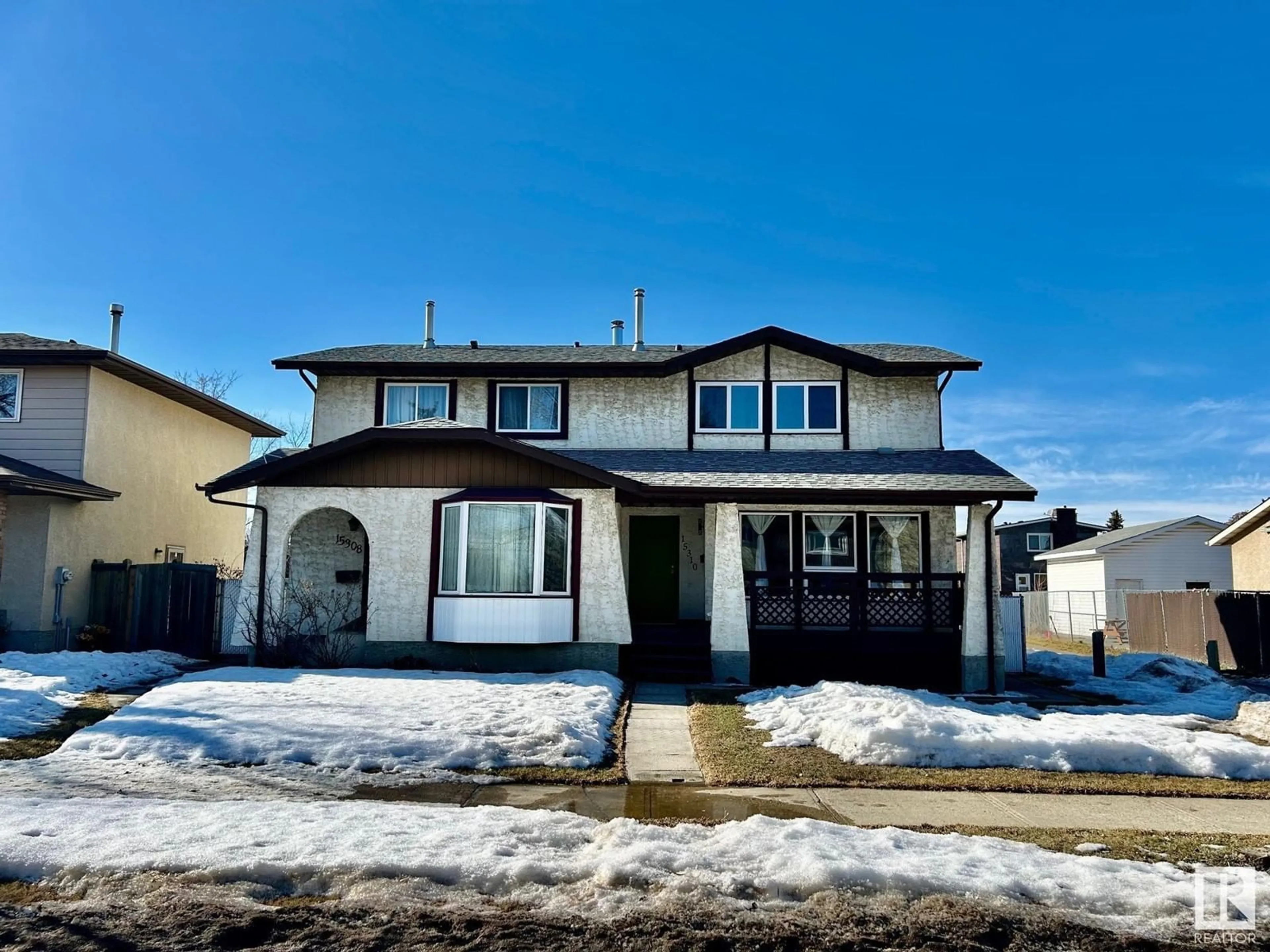 Home with vinyl exterior material, street for 15310 121 ST NW, Edmonton Alberta T5X4K4