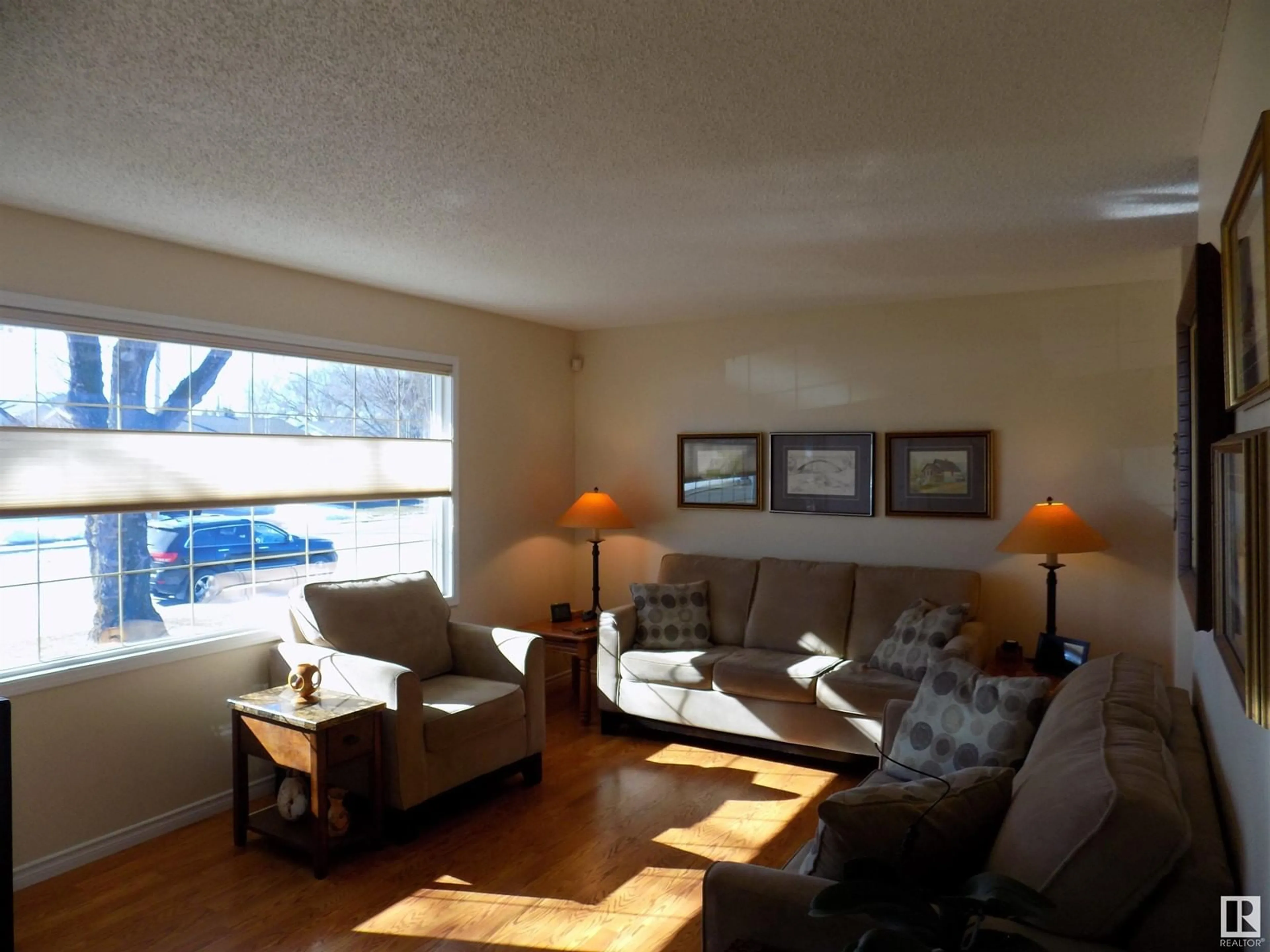 Living room with furniture, wood/laminate floor for 4506 56 AVENUE, Wetaskiwin Alberta T9A2S2