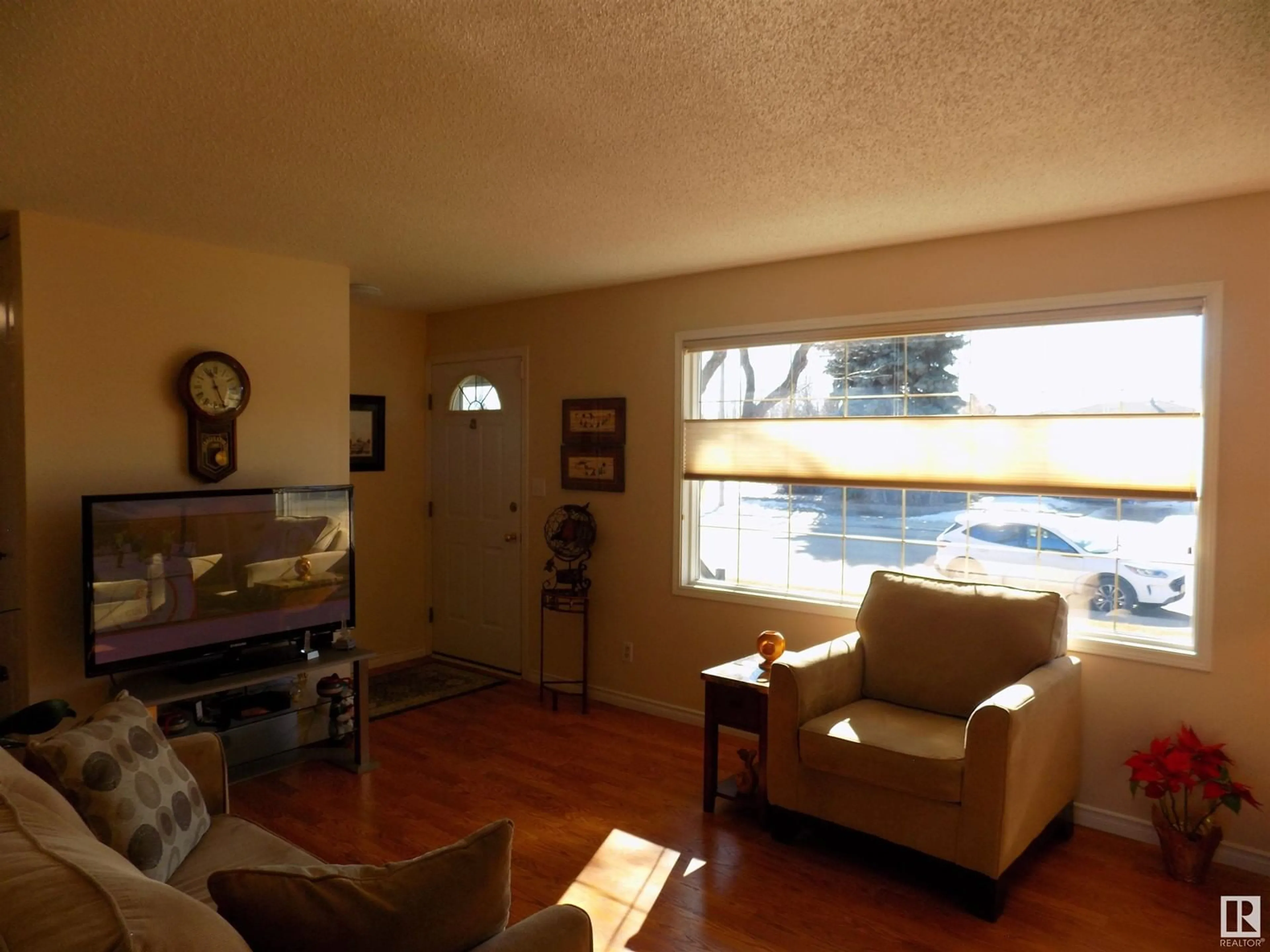 Living room with furniture, wood/laminate floor for 4506 56 AVENUE, Wetaskiwin Alberta T9A2S2