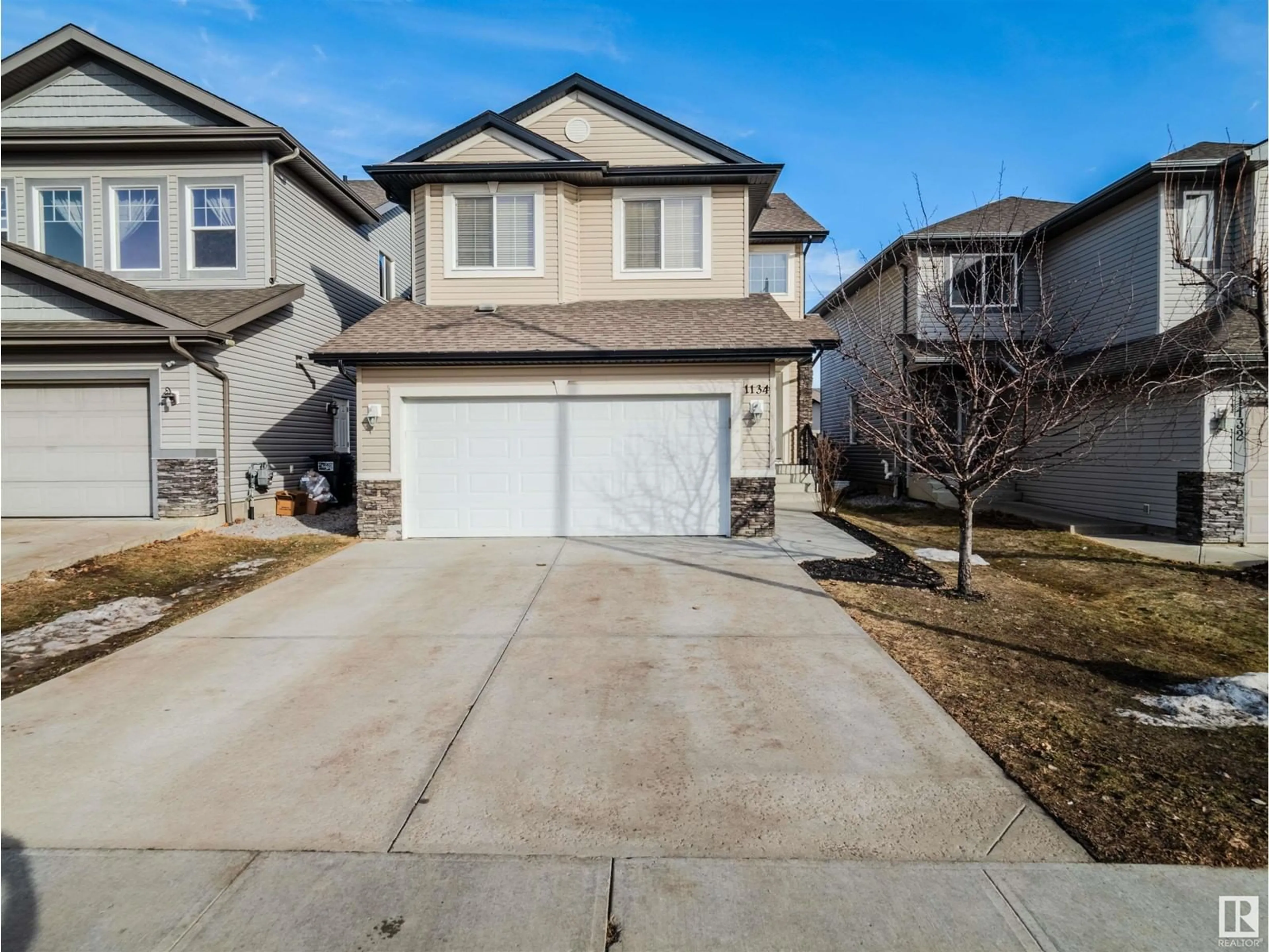 Home with vinyl exterior material, street for 1134 HAYS DR NW, Edmonton Alberta T6M0M2