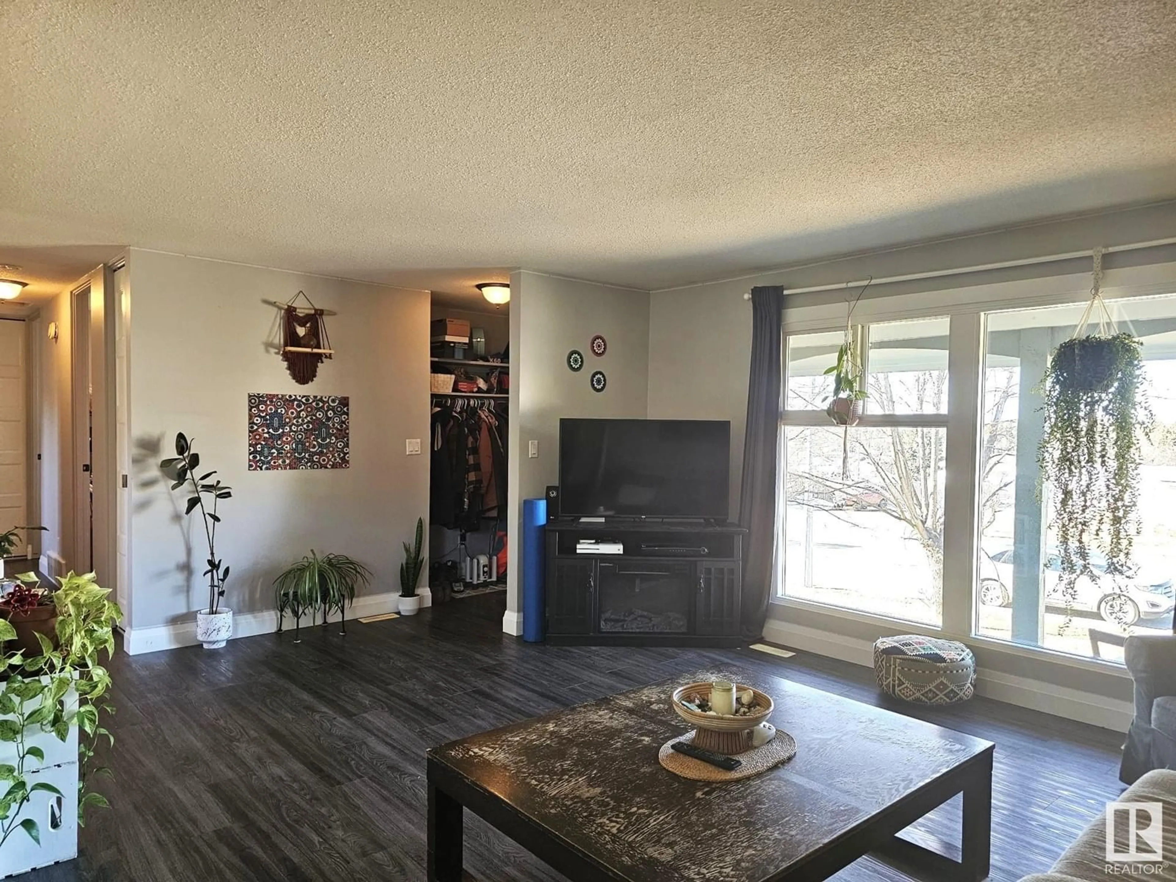 Living room with furniture, wood/laminate floor for 4707 54 ST, Drayton Valley Alberta T7A1K7