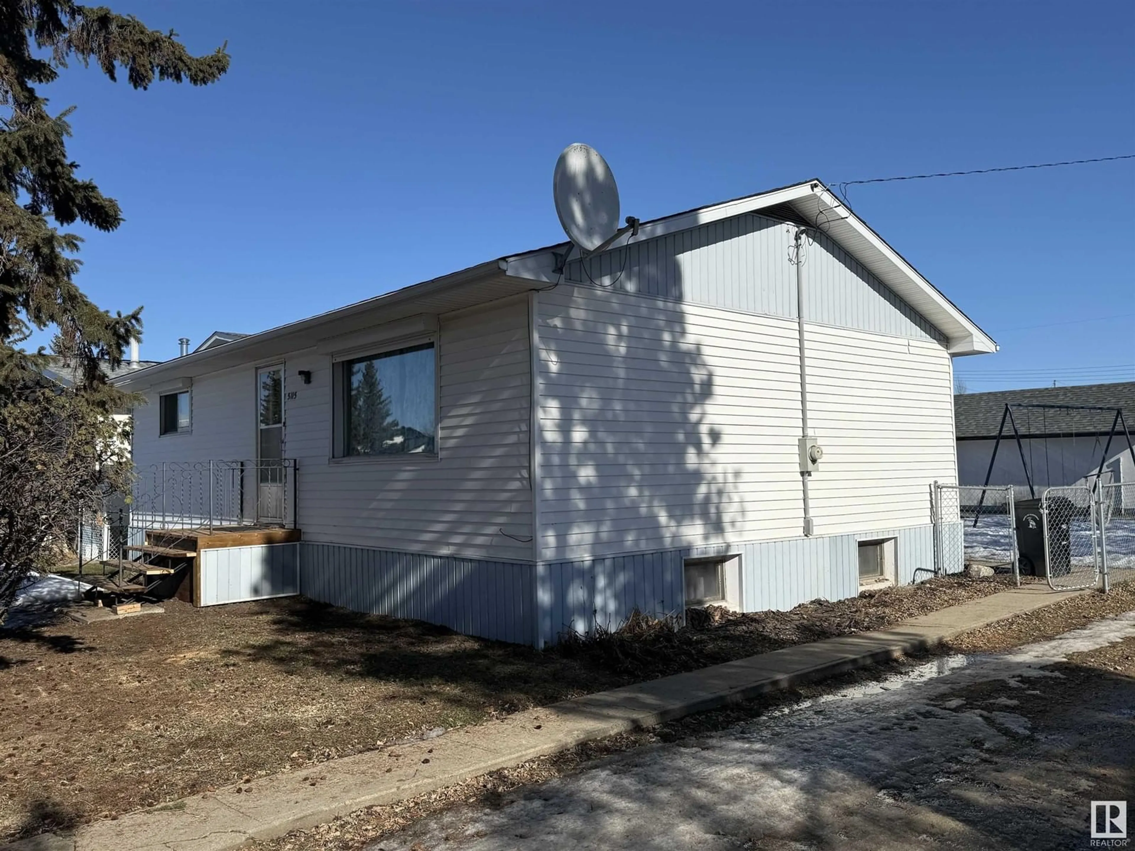 Home with vinyl exterior material, building for 5115 46 ST, Barrhead Alberta T7N1H8