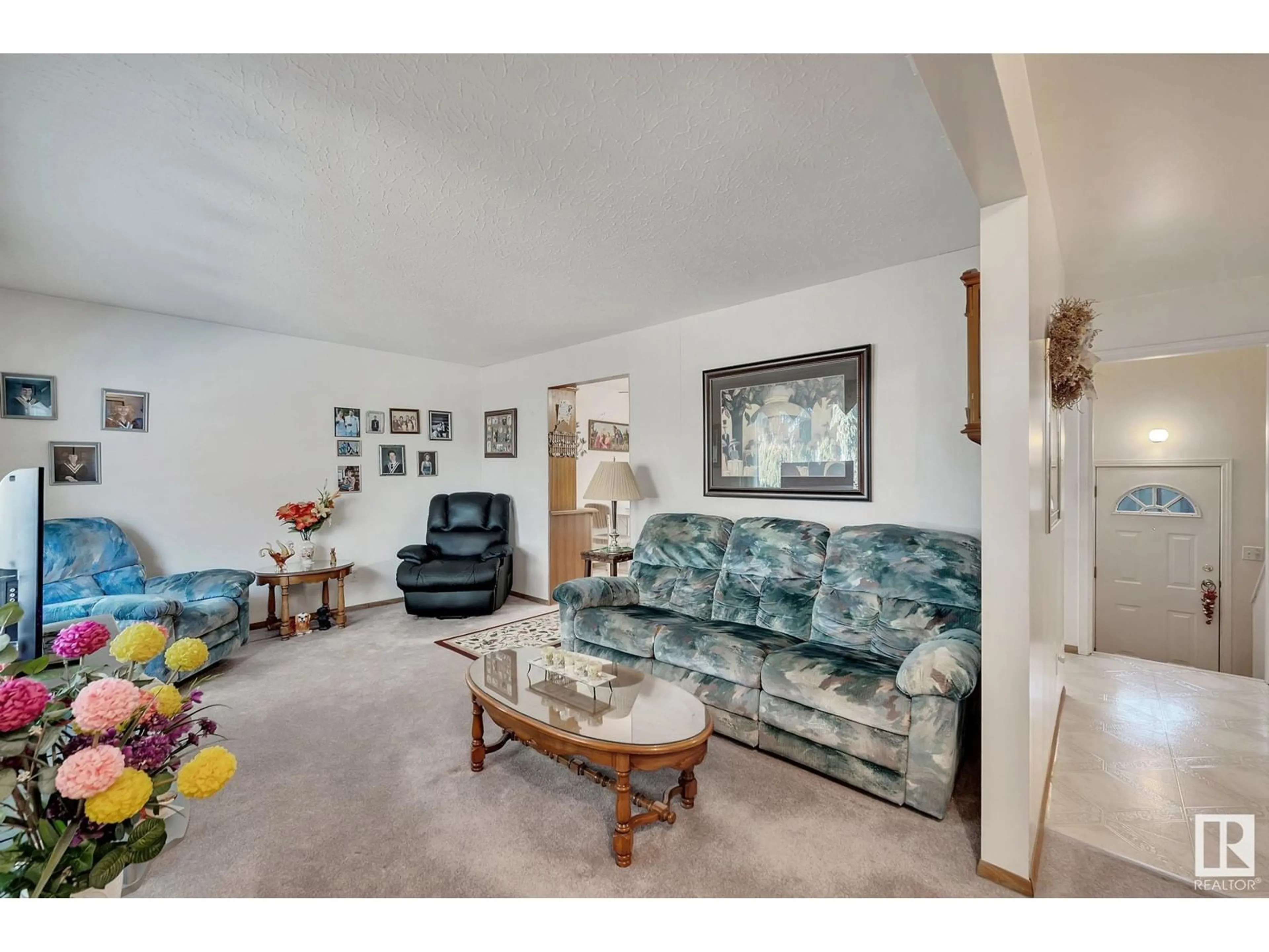 Living room with furniture, carpet floor for 11914 46 ST NW NW, Edmonton Alberta T5W2V9