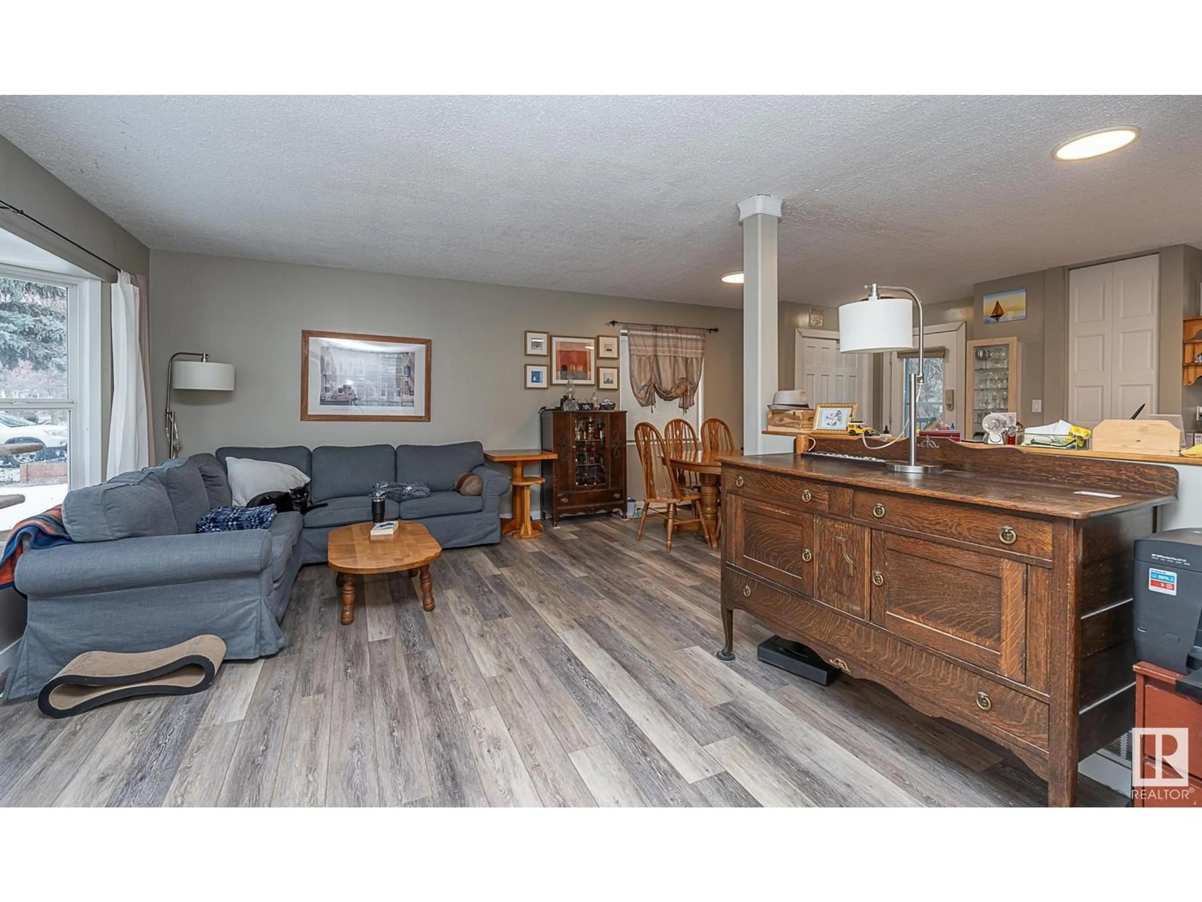 Living room with furniture, wood/laminate floor for 1 Longview CR, St. Albert Alberta T8N2W1