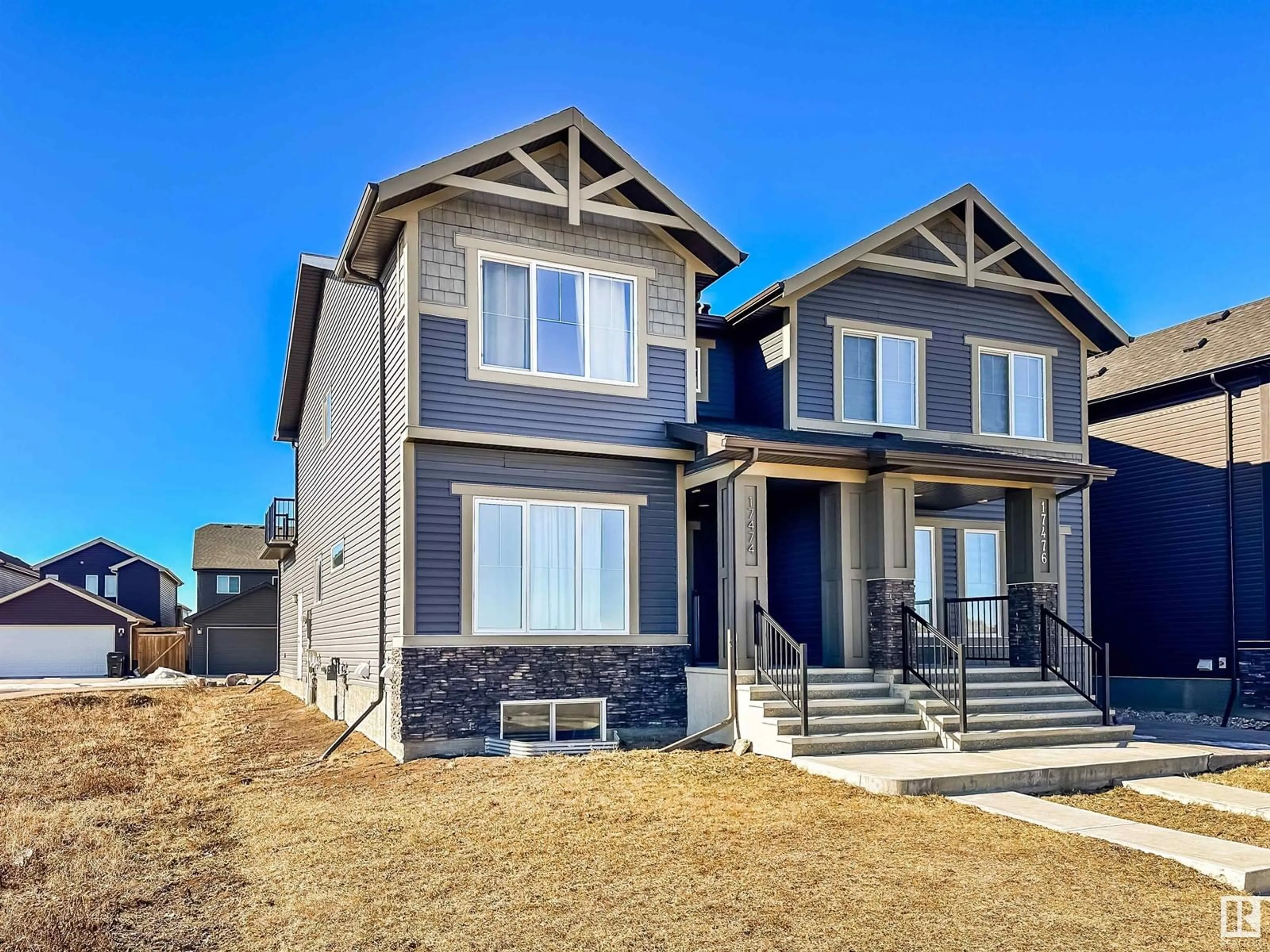 Home with vinyl exterior material, street for 17474 76 ST NW, Edmonton Alberta T5Z0R2