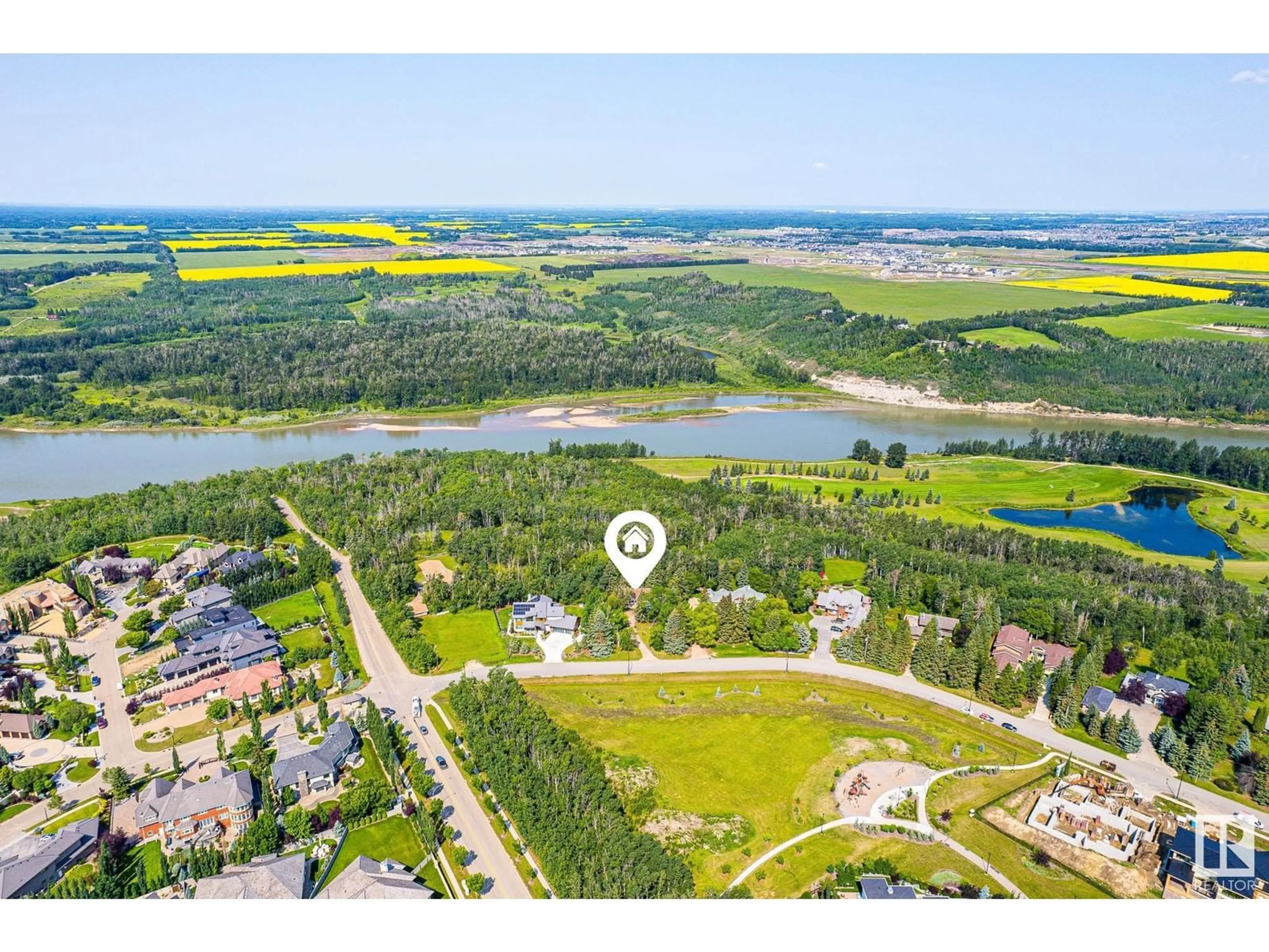A pic from outside/outdoor area/front of a property/back of a property/a pic from drone, water/lake/river/ocean view for 108 WINDERMERE DR, Edmonton Alberta T6W0S4