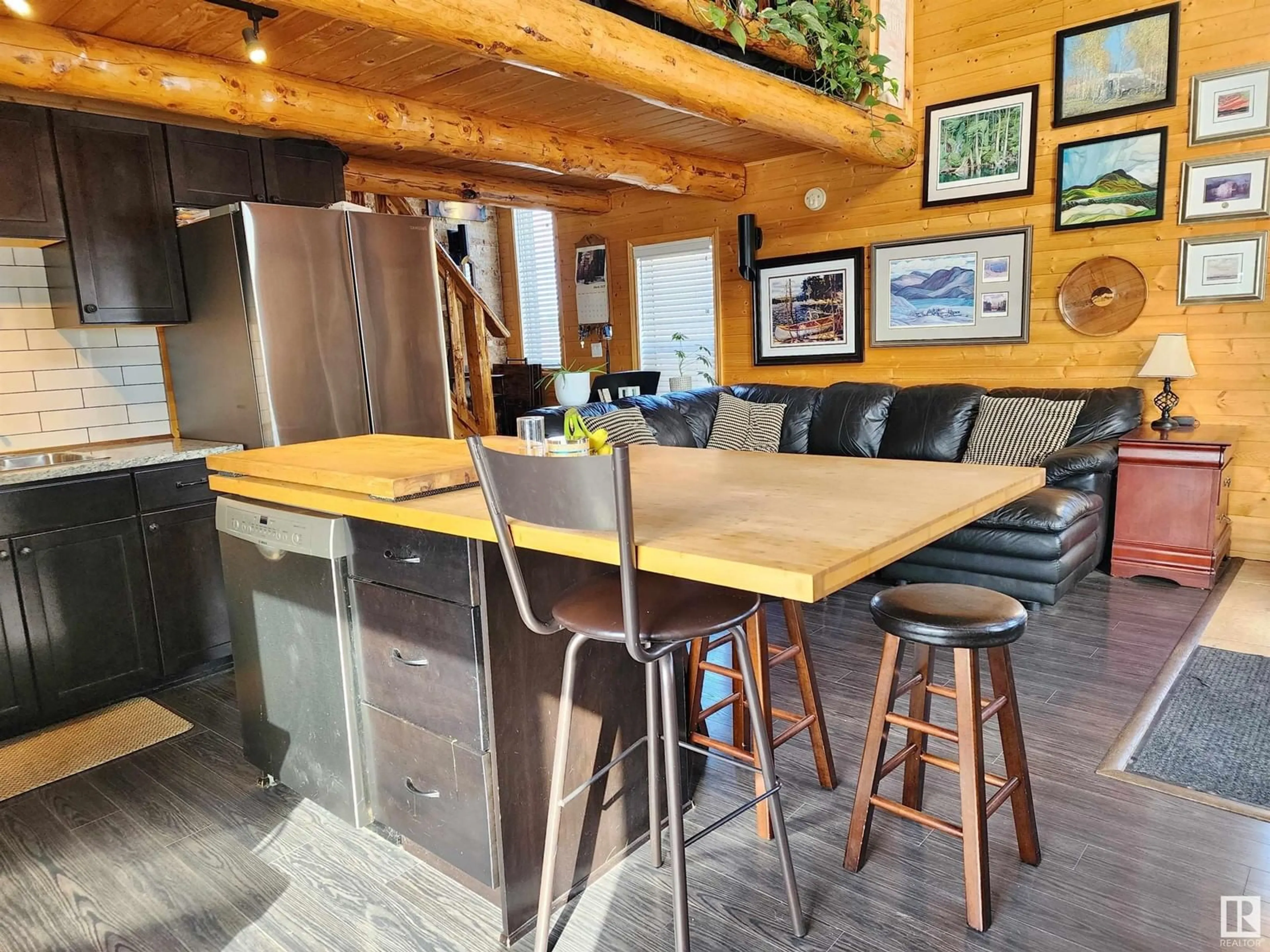Open concept kitchen, wood/laminate floor for 465044 - 105 RGE ROAD 60, Rural Wetaskiwin County Alberta T0C0T0