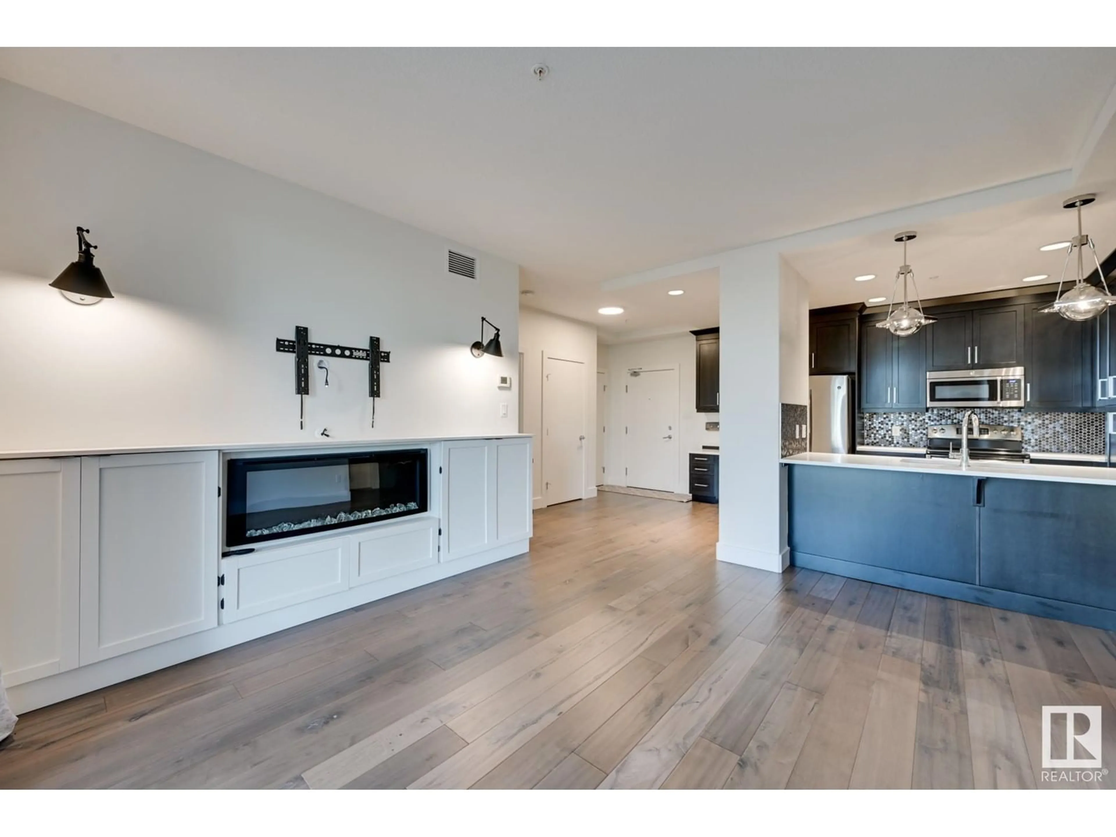 Open concept kitchen, wood/laminate floor for #113 11080 ELLERSLIE RD SW, Edmonton Alberta T6W2C2