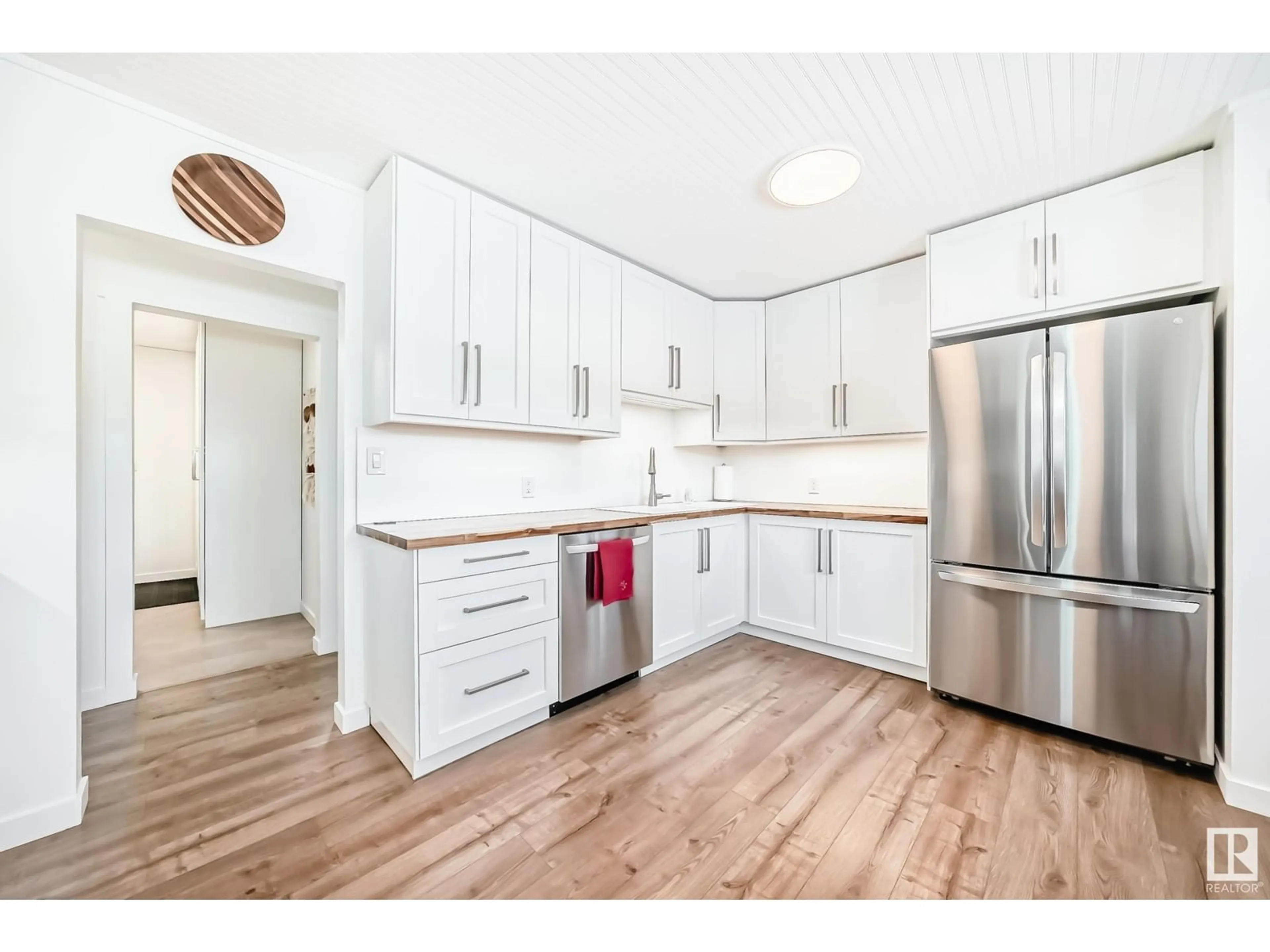 Open concept kitchen, wood/laminate floor for 4925 55 AV, Cynthia Alberta T0E0K0