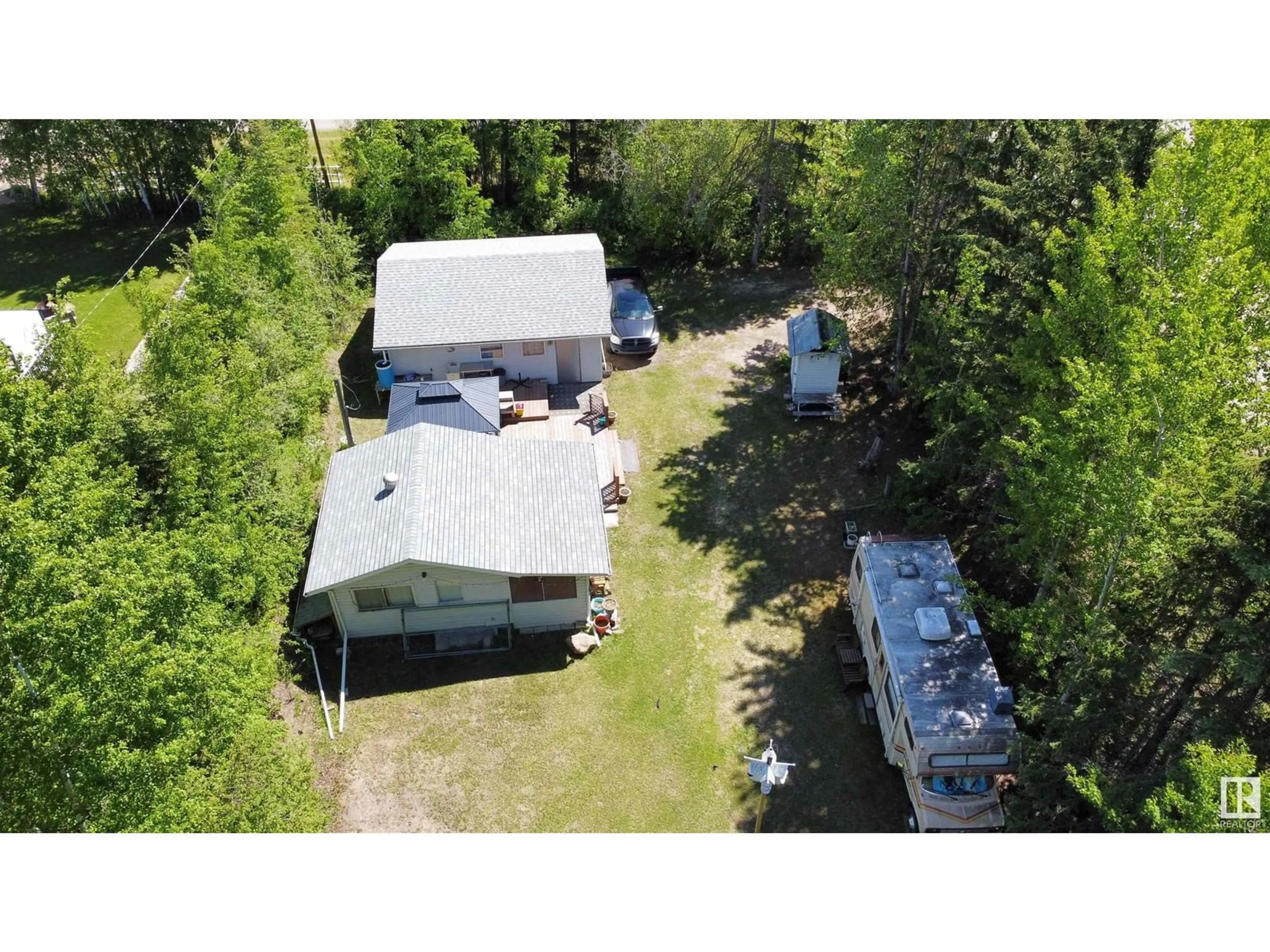 A pic from outside/outdoor area/front of a property/back of a property/a pic from drone, unknown for 2 - 4418 HWY 633, Rural Lac Ste. Anne County Alberta T0E0L0