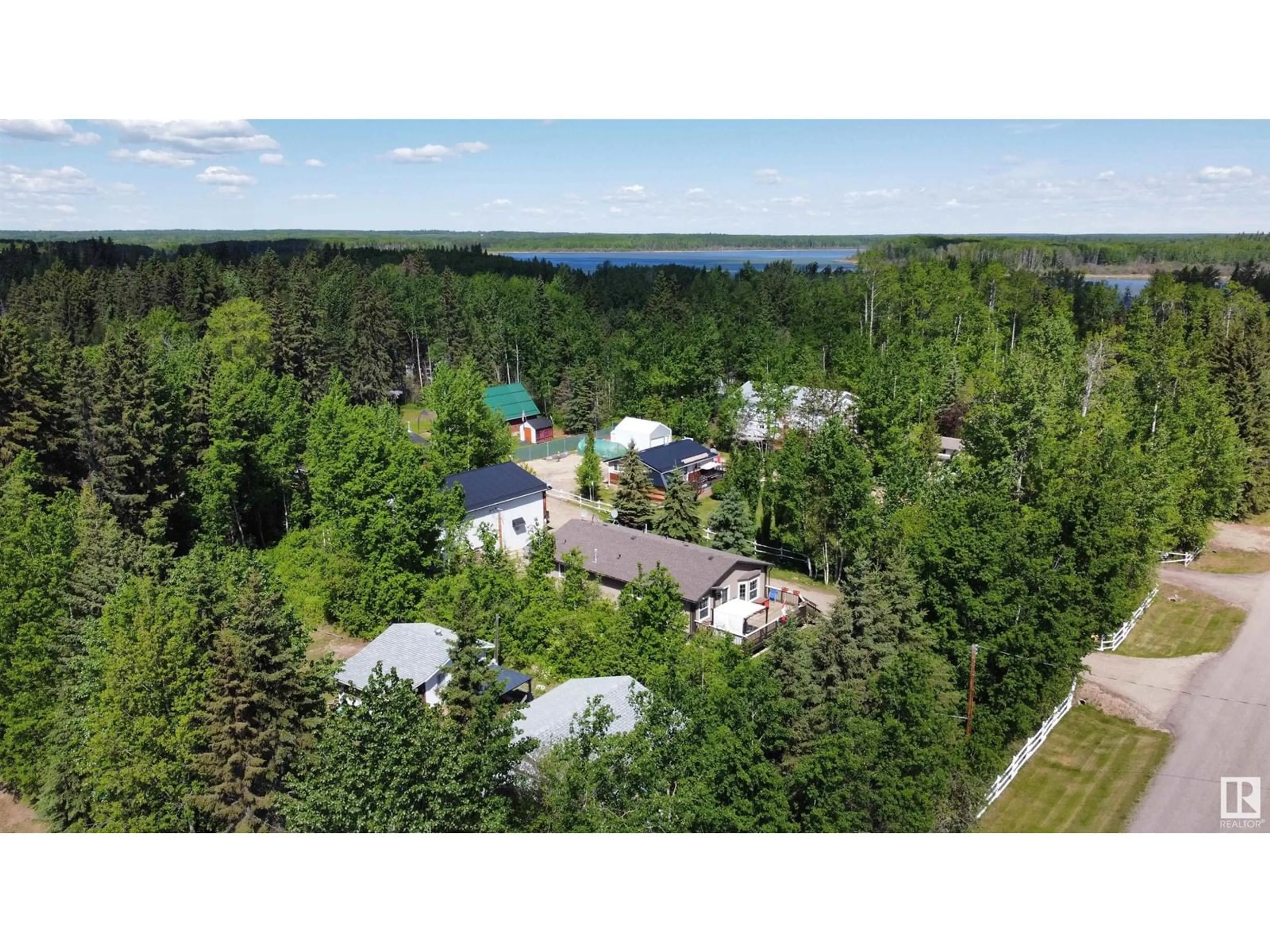 A pic from outside/outdoor area/front of a property/back of a property/a pic from drone, forest/trees view for 2 - 4418 HWY 633, Rural Lac Ste. Anne County Alberta T0E0L0