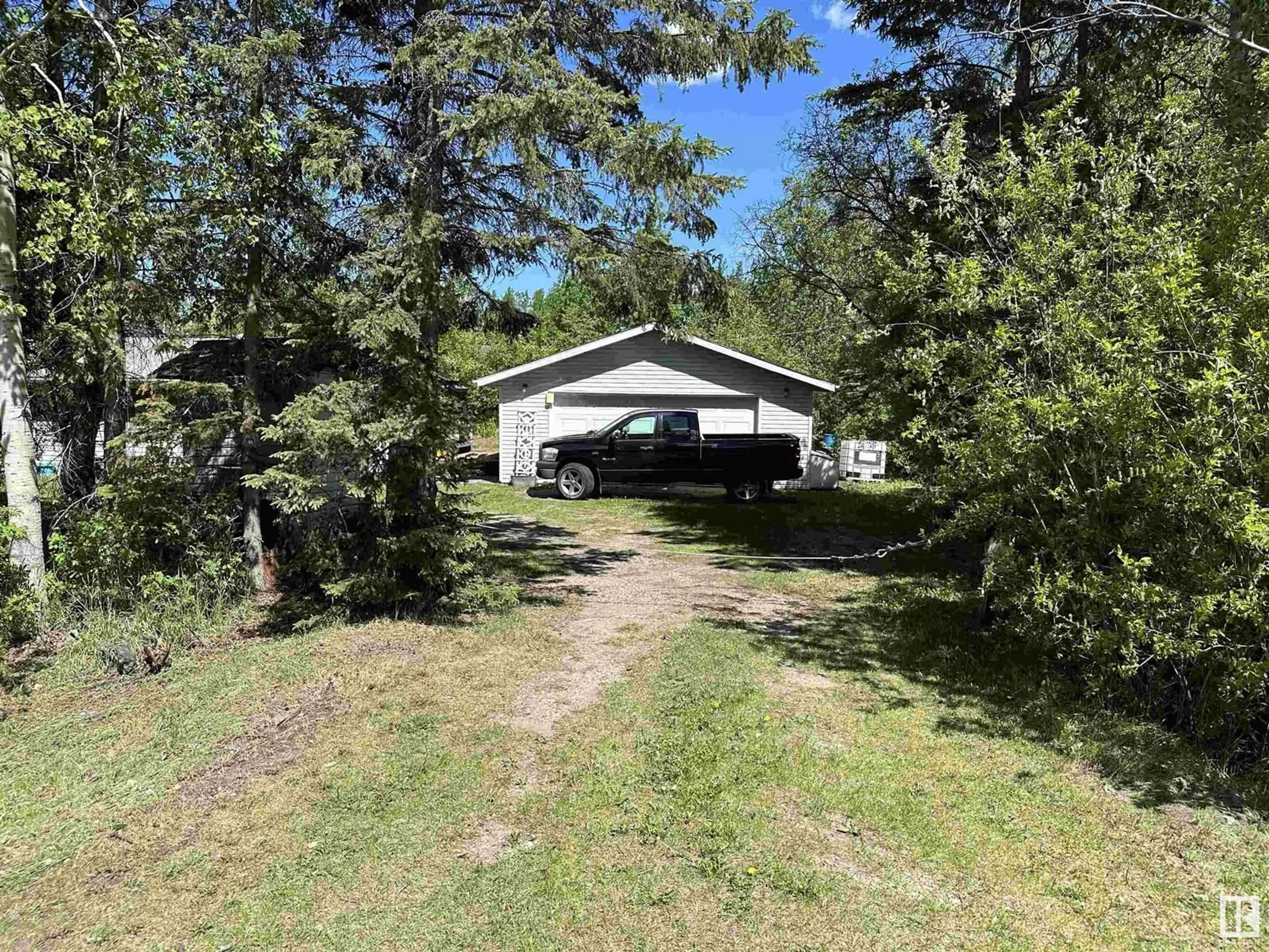 A pic from outside/outdoor area/front of a property/back of a property/a pic from drone, forest/trees view for 2 - 4418 HWY 633, Rural Lac Ste. Anne County Alberta T0E0L0