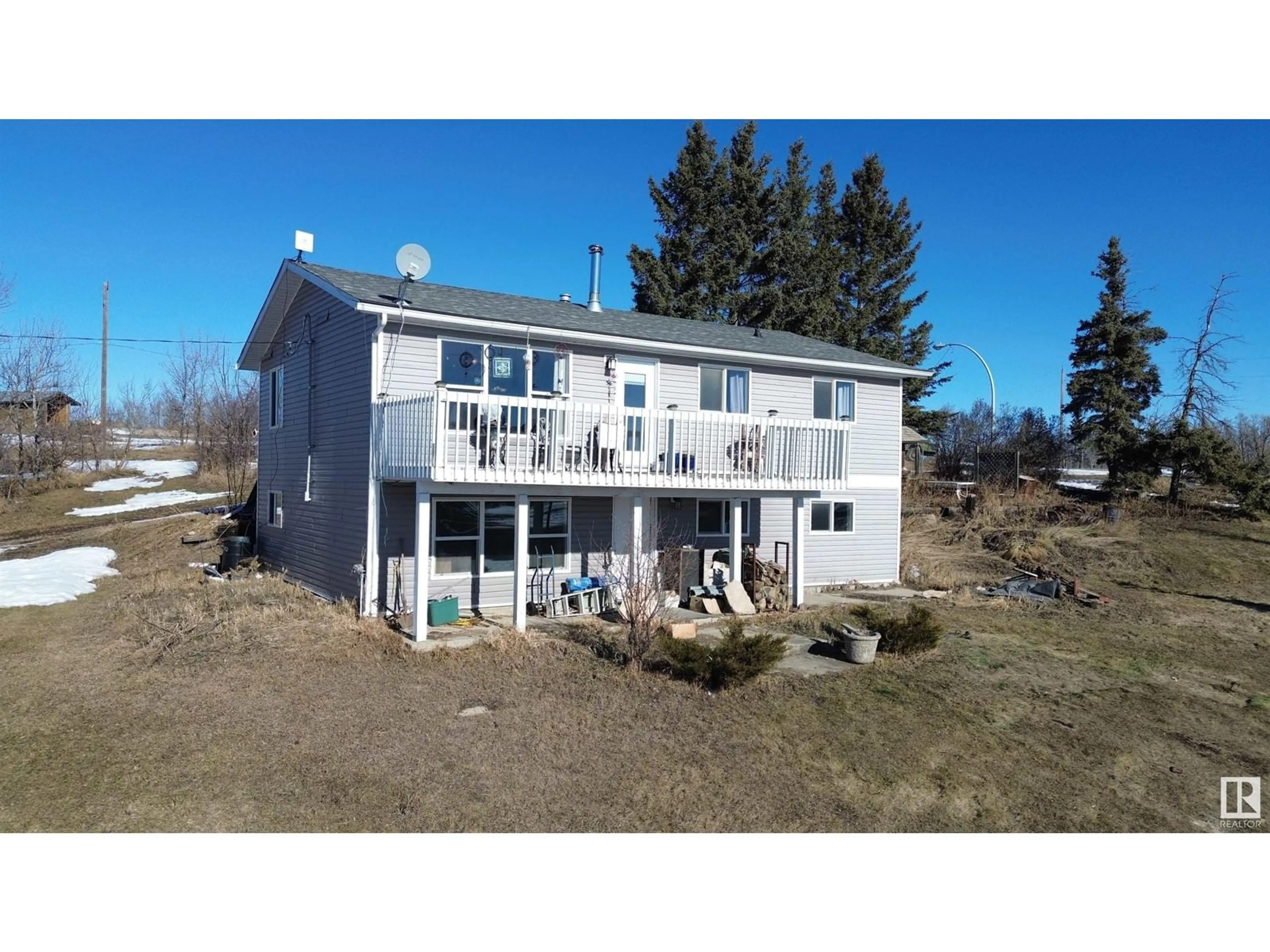 A pic from outside/outdoor area/front of a property/back of a property/a pic from drone, water/lake/river/ocean view for 56024 RGE ROAD 13, Rural Lac Ste. Anne County Alberta T0E1V0