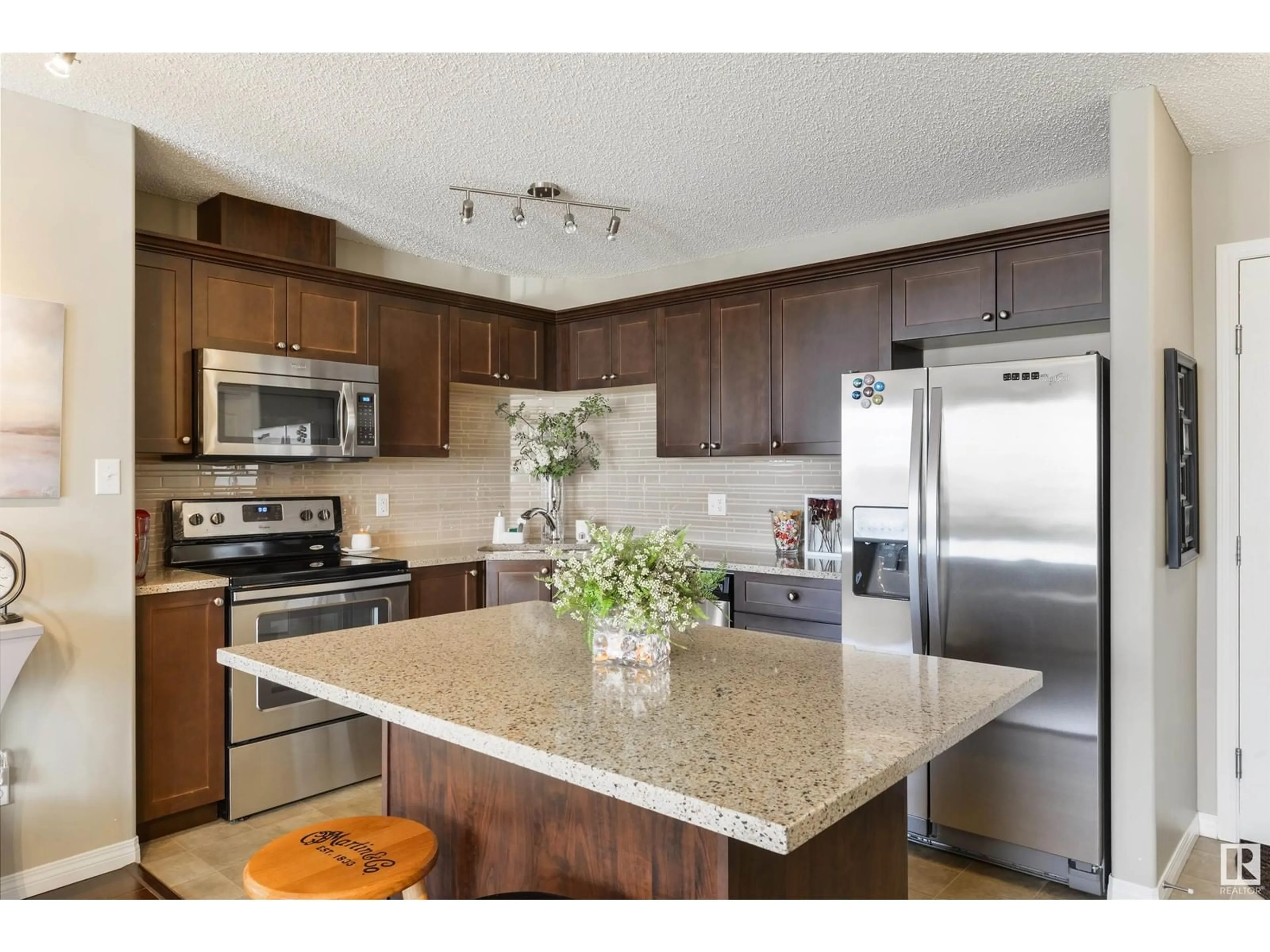 Open concept kitchen, unknown for #116 1520 Hammond Gate NW, Edmonton Alberta T6M0J4