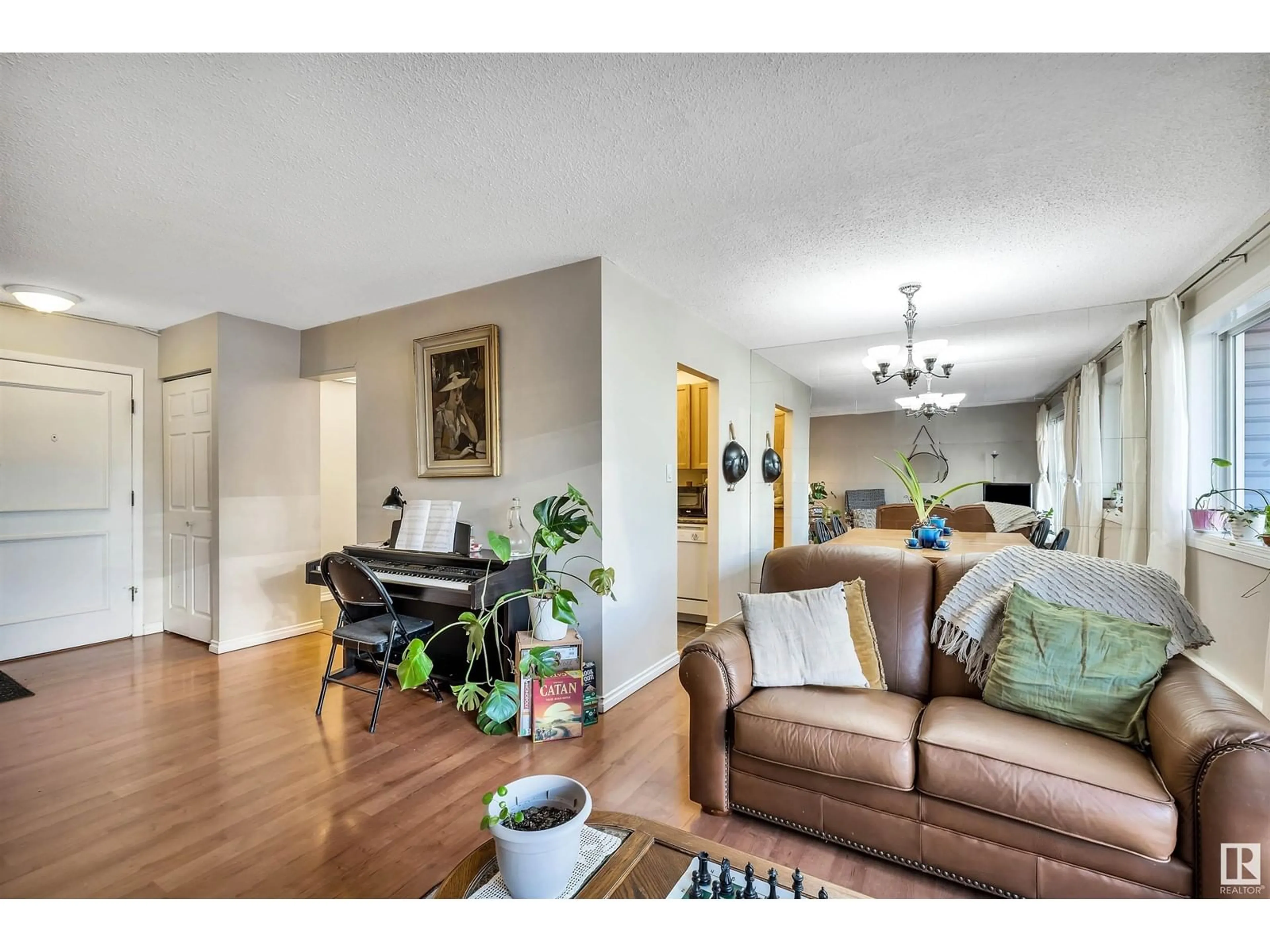 Living room with furniture, wood/laminate floor for #303 8149 111 ST NW, Edmonton Alberta T6G2P1