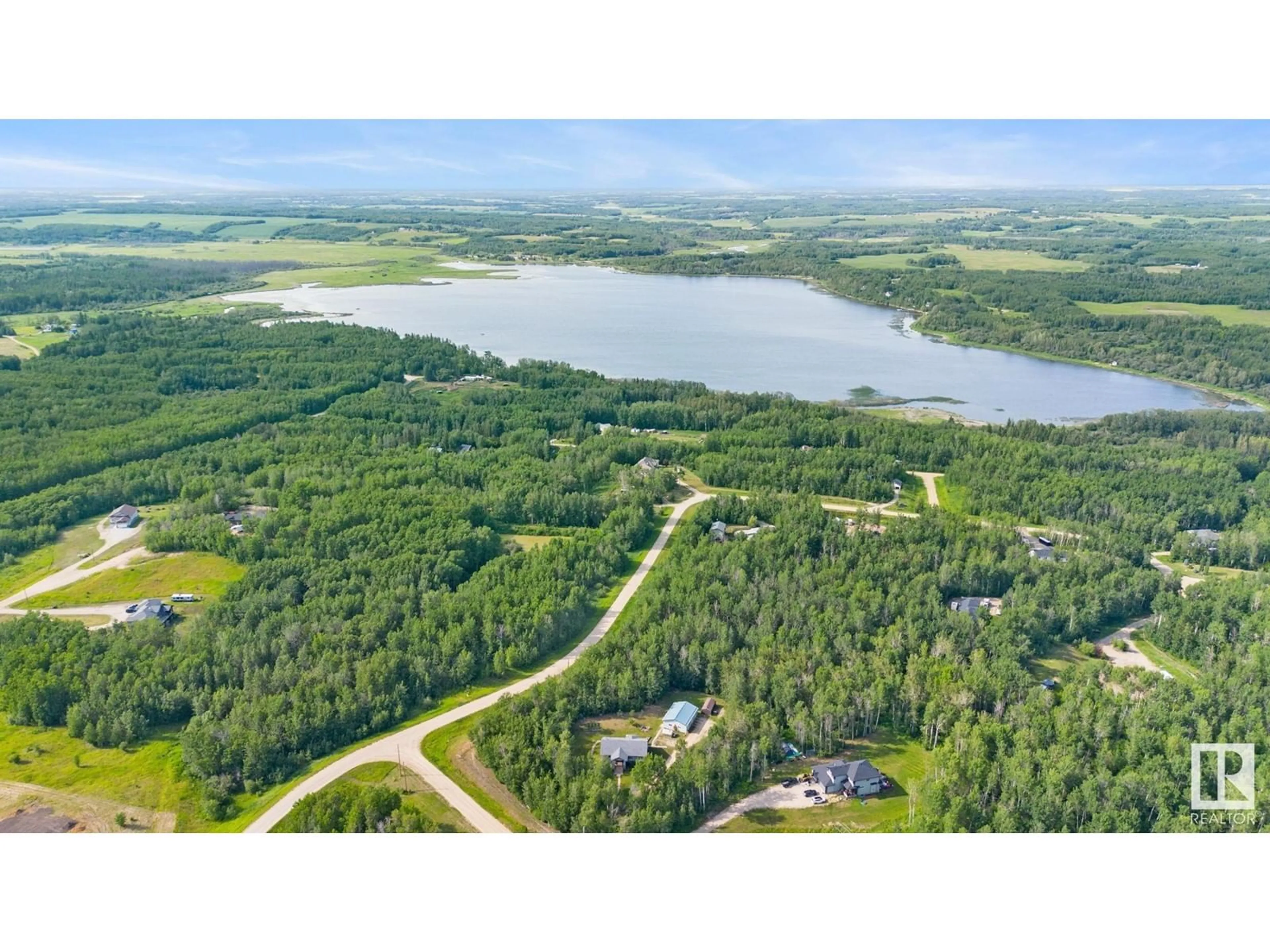 A pic from outside/outdoor area/front of a property/back of a property/a pic from drone, water/lake/river/ocean view for 54419 RGE RD 14, Rural Lac Ste. Anne County Alberta T0E1V0