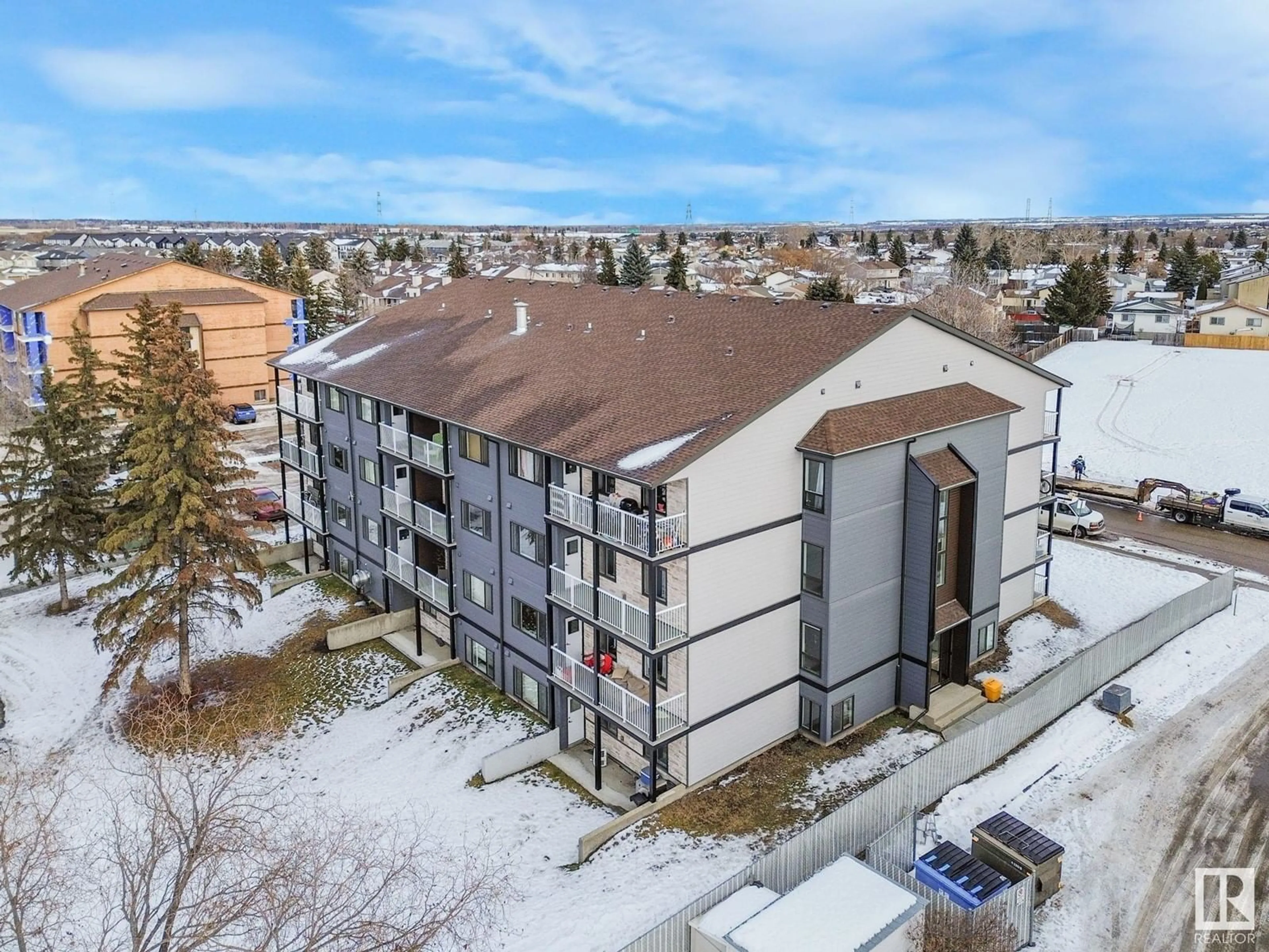 A pic from outside/outdoor area/front of a property/back of a property/a pic from drone, building for #402 14808 26 ST NW, Edmonton Alberta T5Y2G4