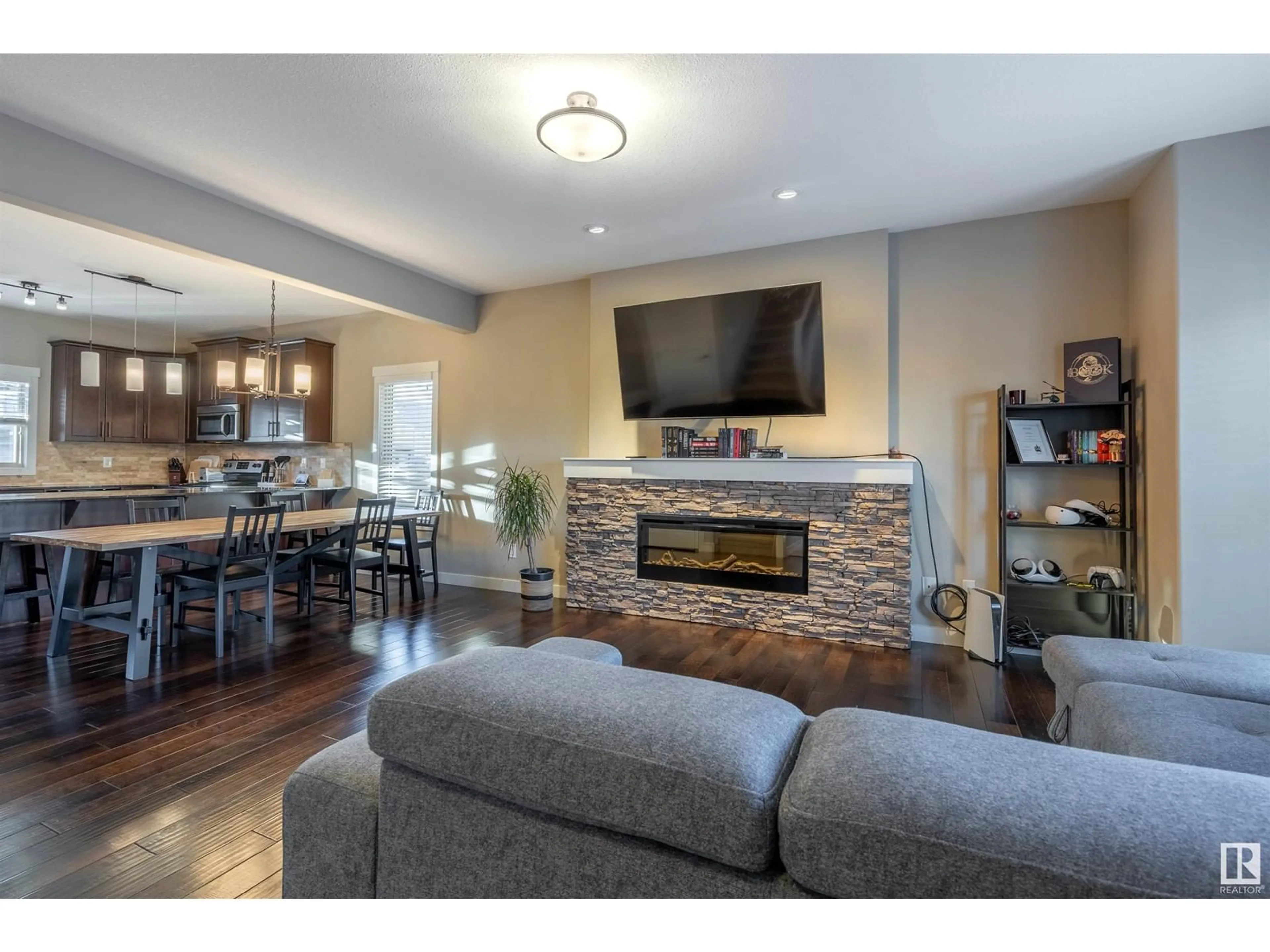 Living room with furniture, wood/laminate floor for 15 GREENBURY BV, Spruce Grove Alberta T7X0M1