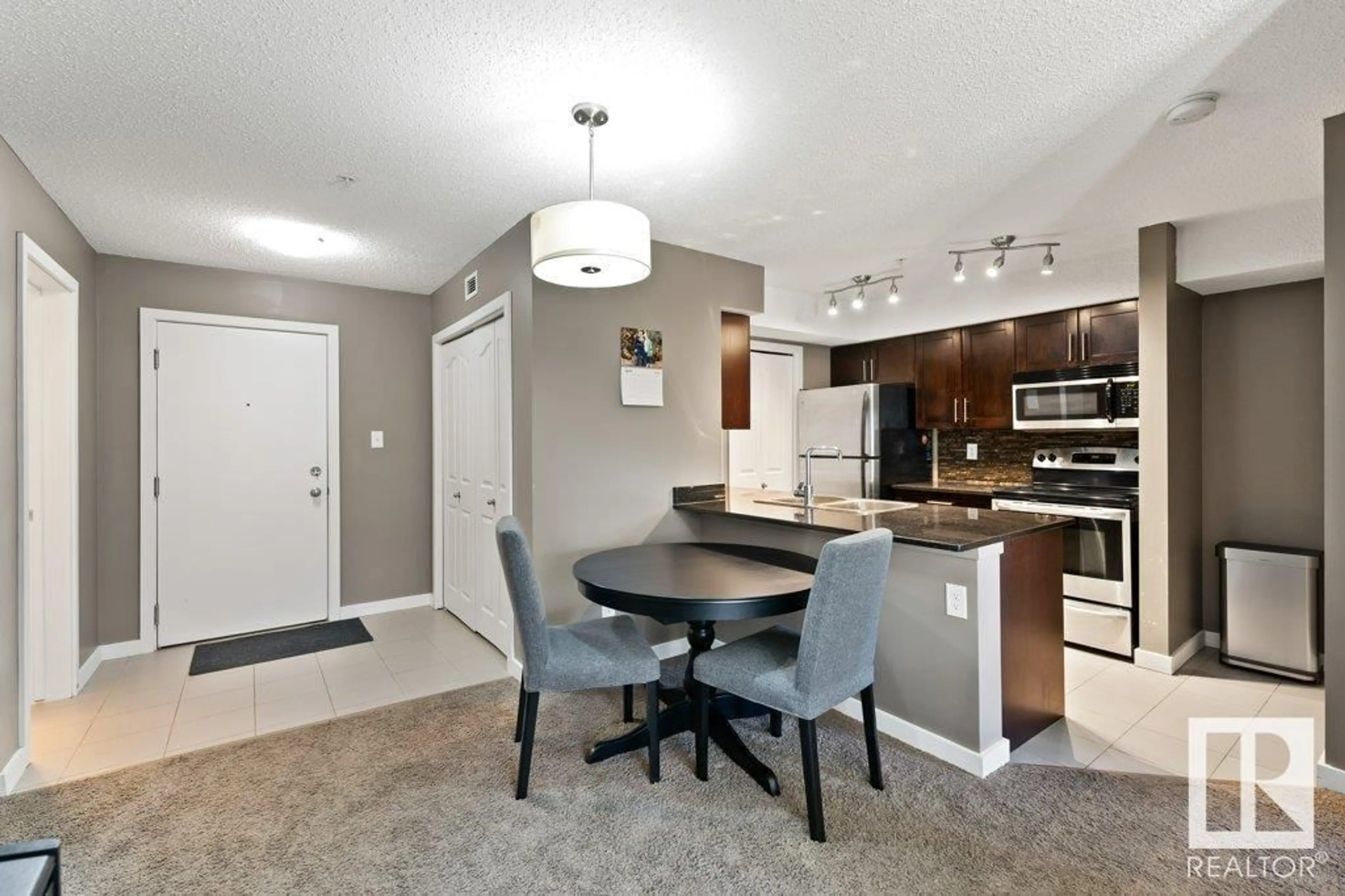 Open concept kitchen, unknown for #110 1060 MCCONACHIE BV NW, Edmonton Alberta T5Y0W9